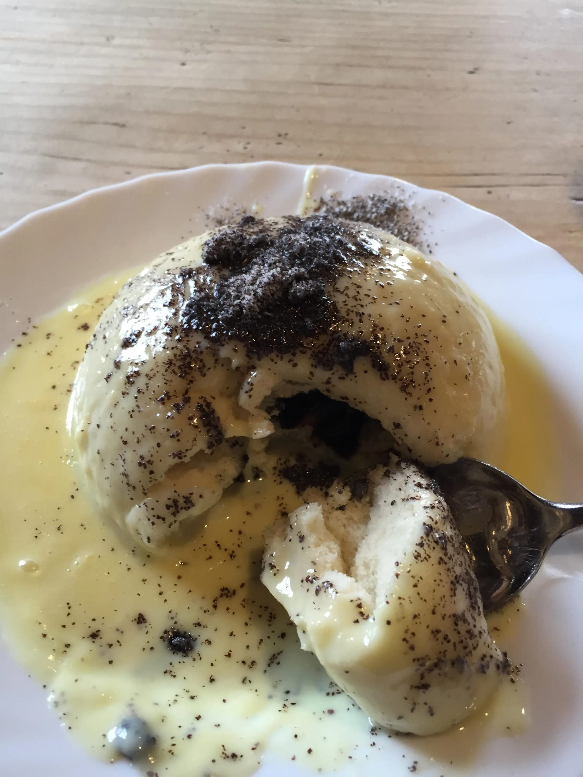 Photo by Author — lunch at Rubezahlhutte — a steamed bun with a ham filling and custard