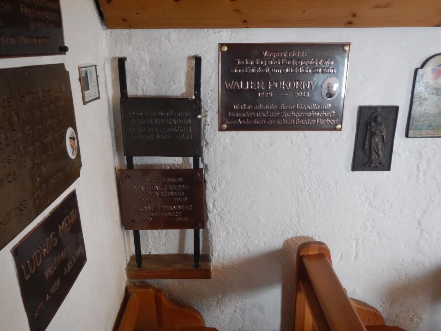 Photo by Author — Inside the Piste Chapel, Niederau, Austria — Memorial tablets