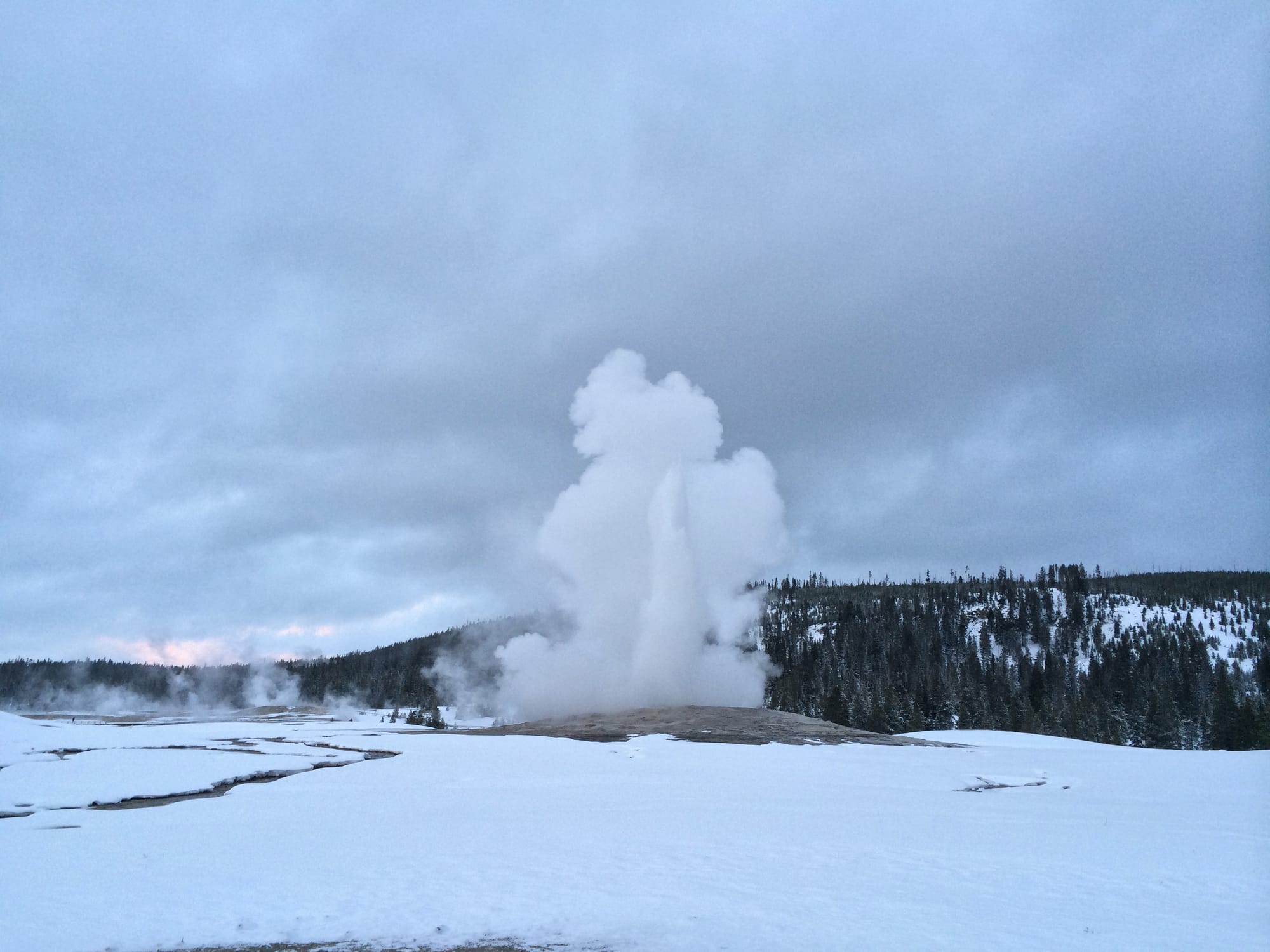 Photo by Author — Old Faithful erupting, Yellowstone National Park