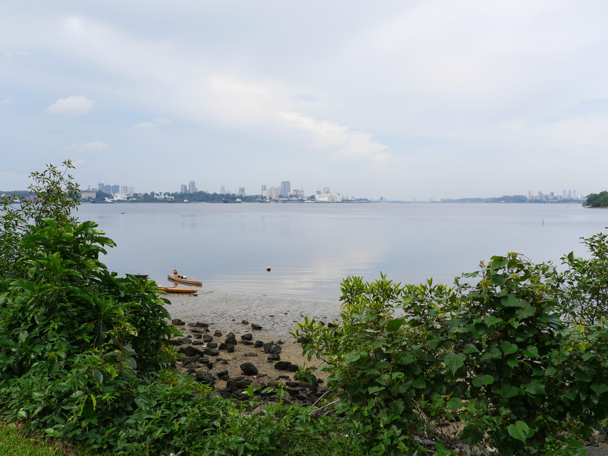 Photo by Author — looking across the water to Johor Bahru, Malaysia from Kranji Beach Battle Site park, Singapore