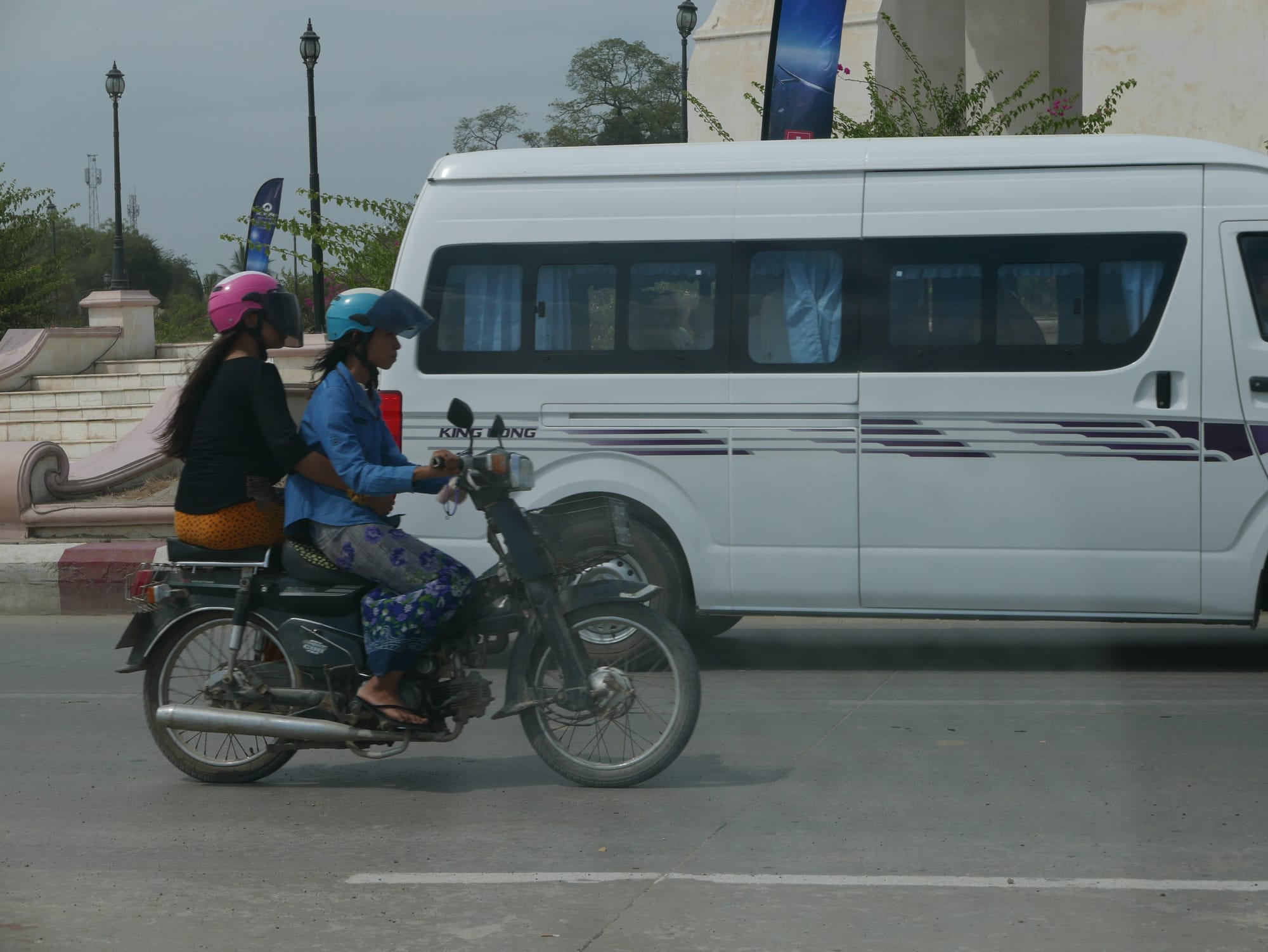 Photo by Author — pillion passenger riding sidesaddle — Myanmar
