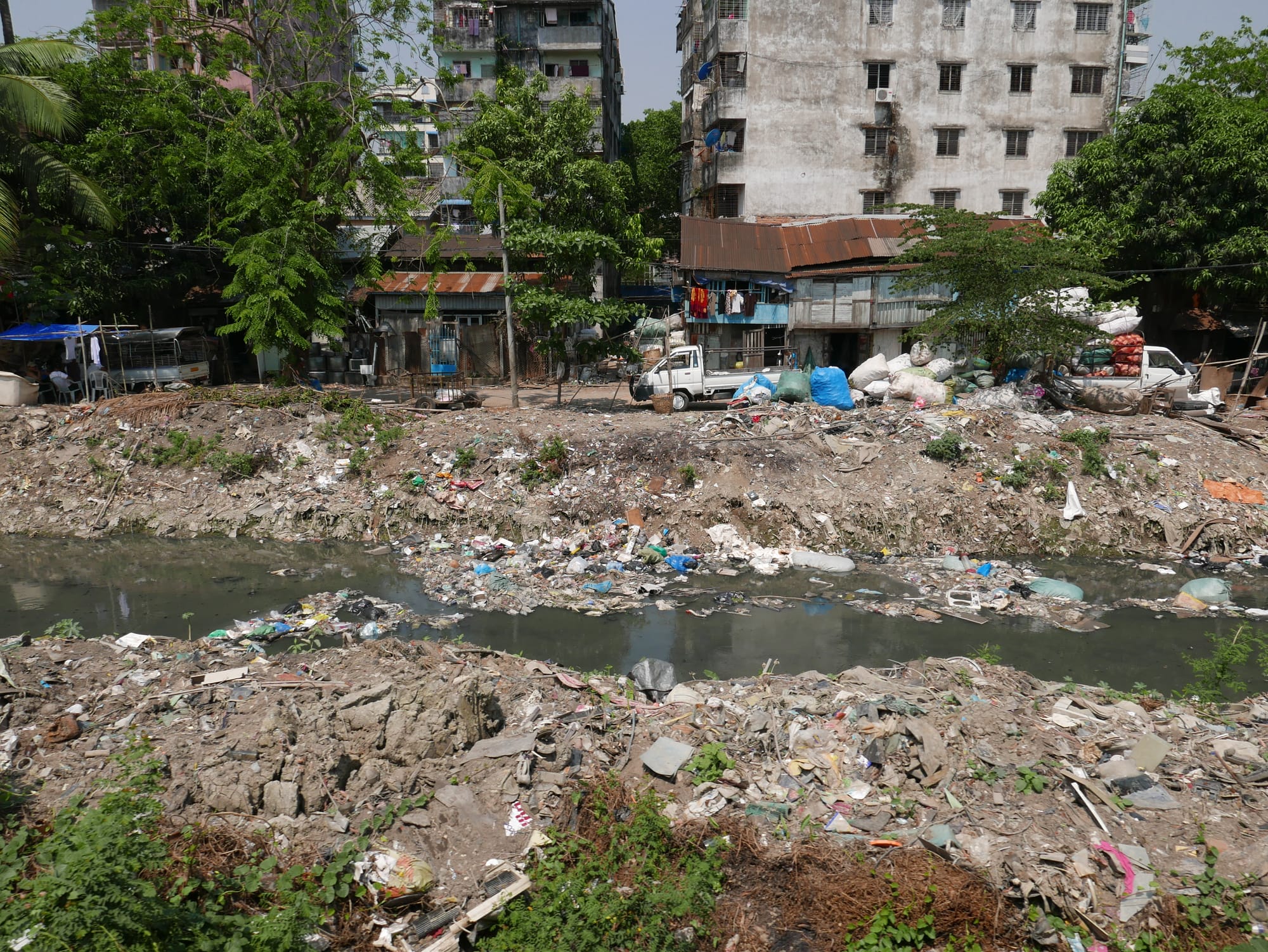Photo by Author — plastic choking the waterways — view from the Yangon Railway