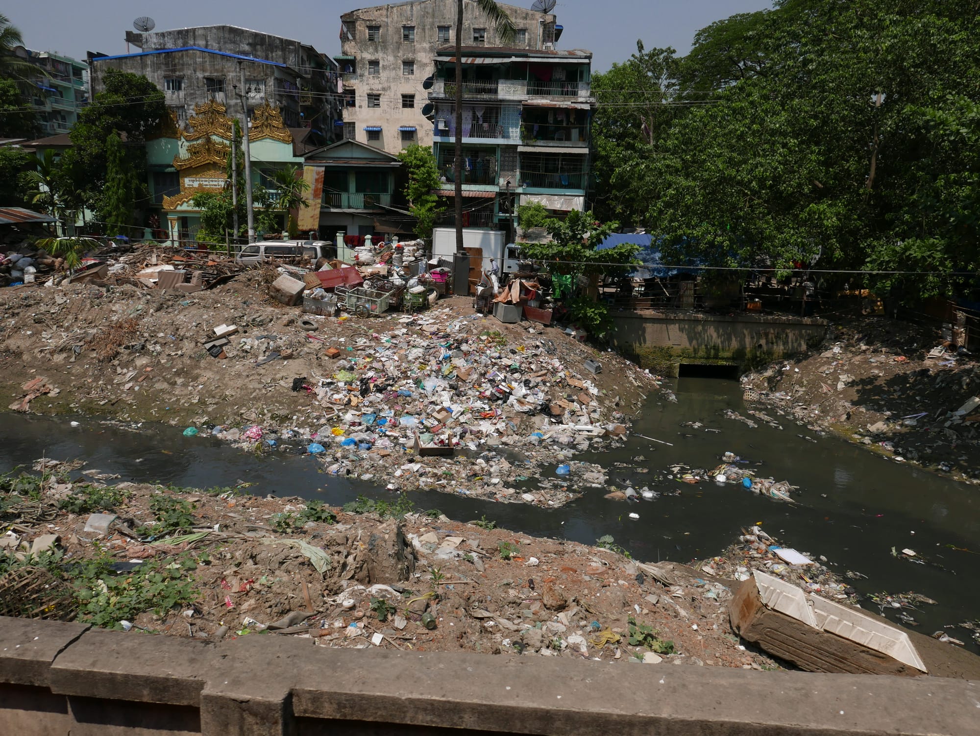Photo by Author — plastic choking the waterways — view from the Yangon Railway