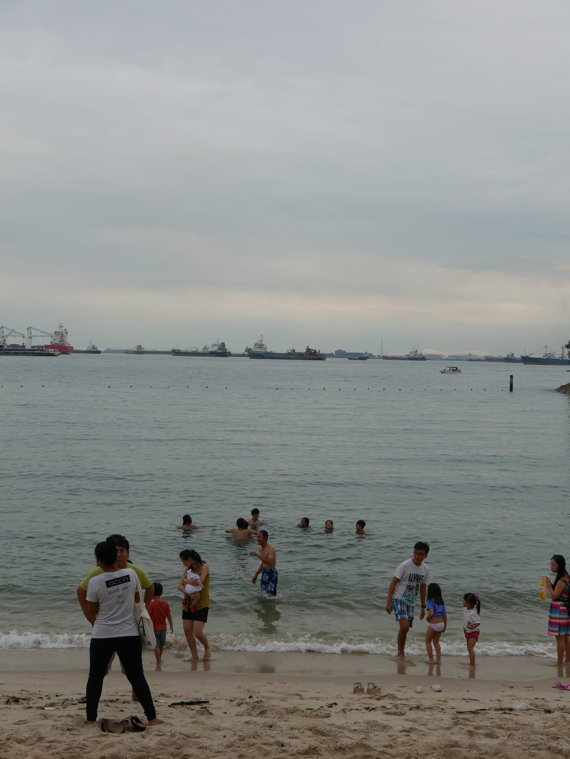 Photo by Author — swimming in the sea (note the ships) — Sentosa Island, Singapore