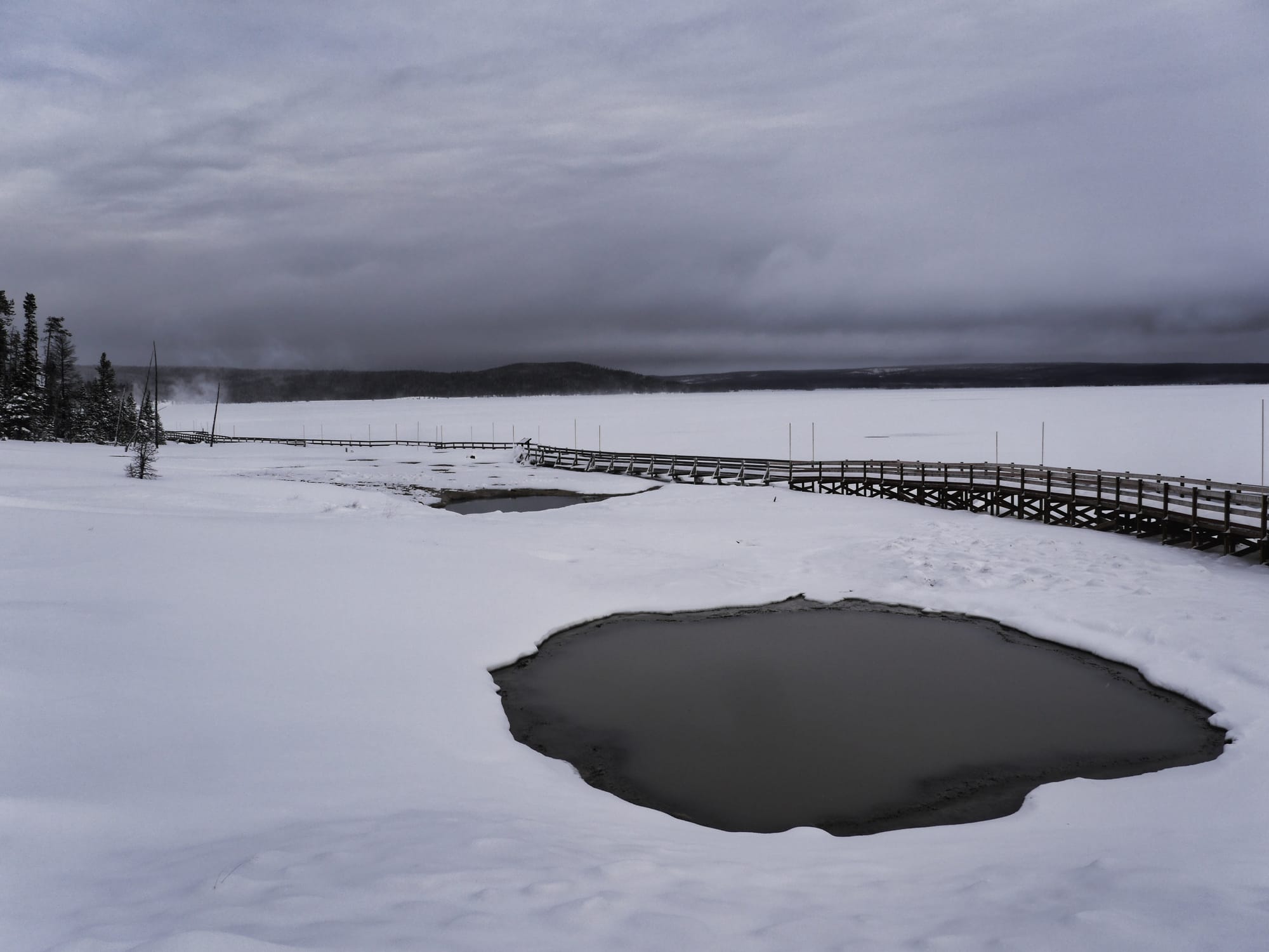 Photo by Author — West Thumb Geyser Basin — West Thumb and Yellowstone Lake in the distance