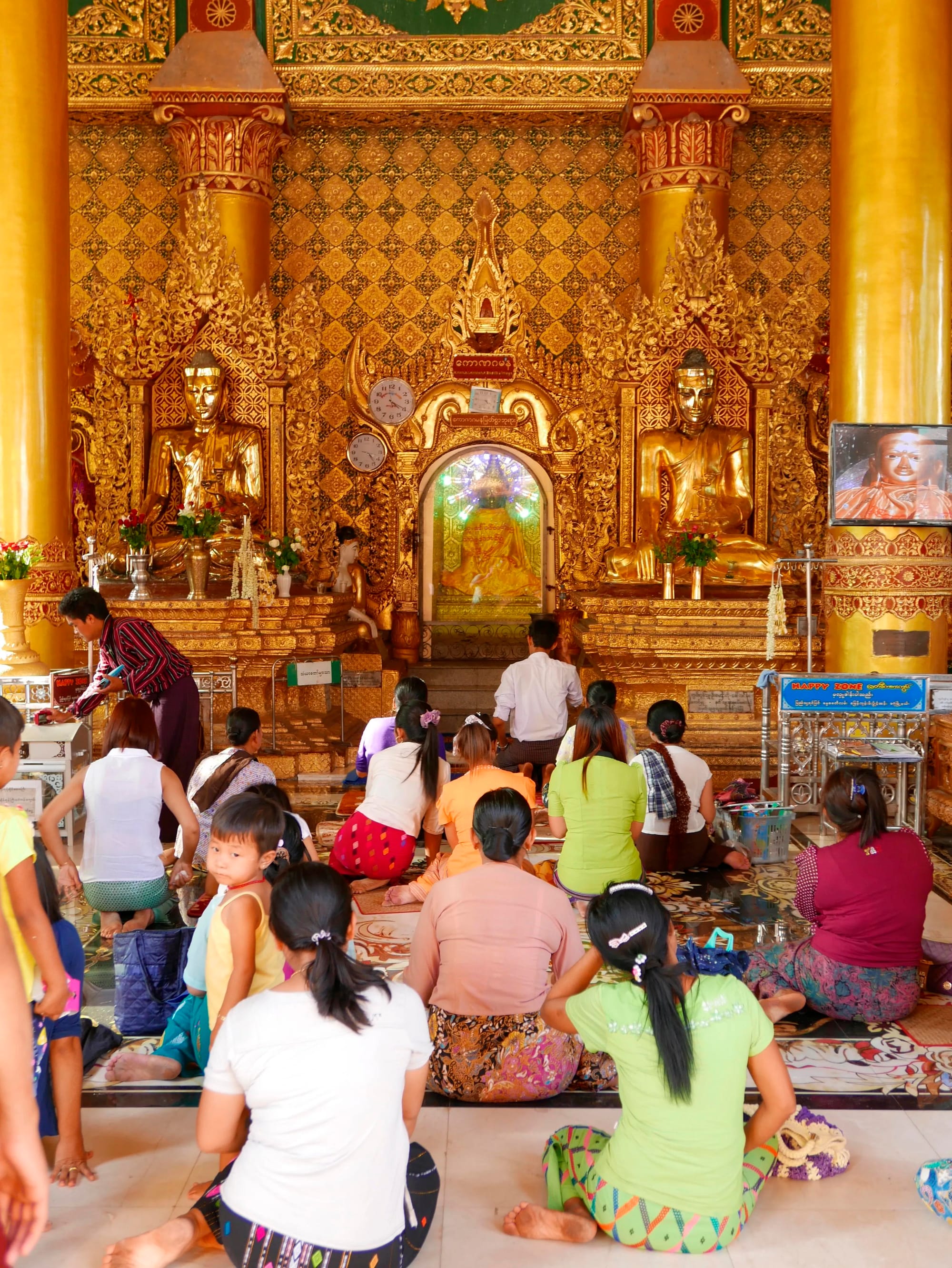 Photo by Author — worshippers at the Shwedagon Pagoda