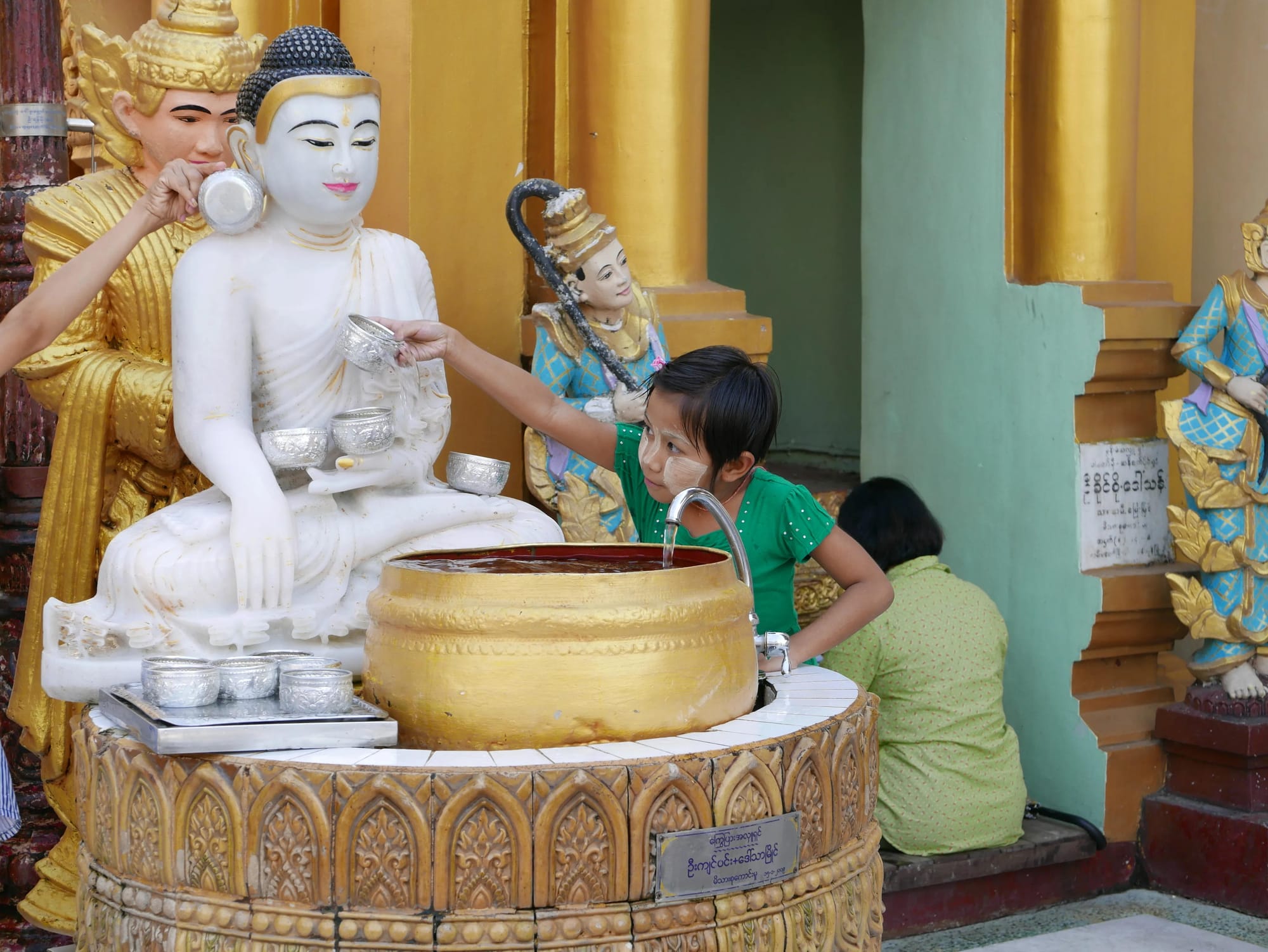 Photo by Author — a worshipper at the Shwedagon Pagoda