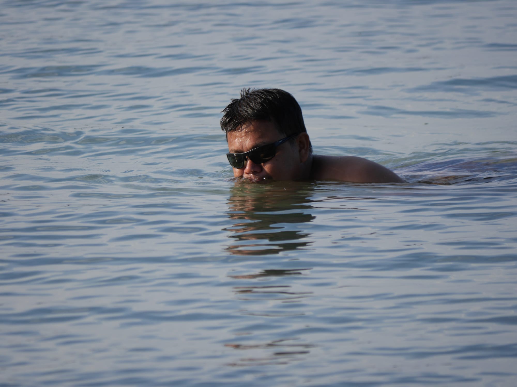 Photo by Author — swimming in the sea at Tanjung Balau Beach, Kota Tinggi, Johor, Malaysia