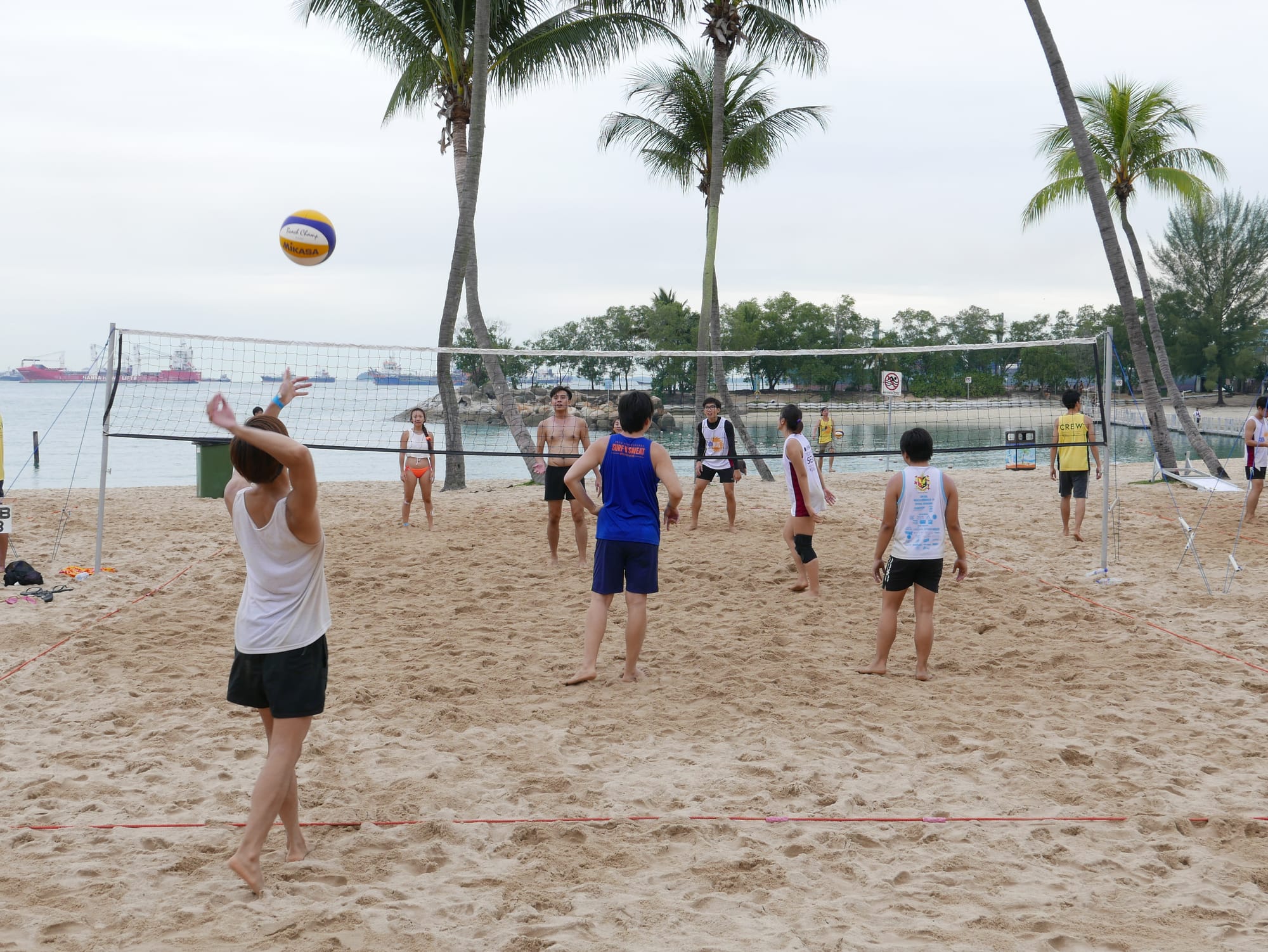 Photo by Author — playing volleyball — Sentosa Island, Singapore