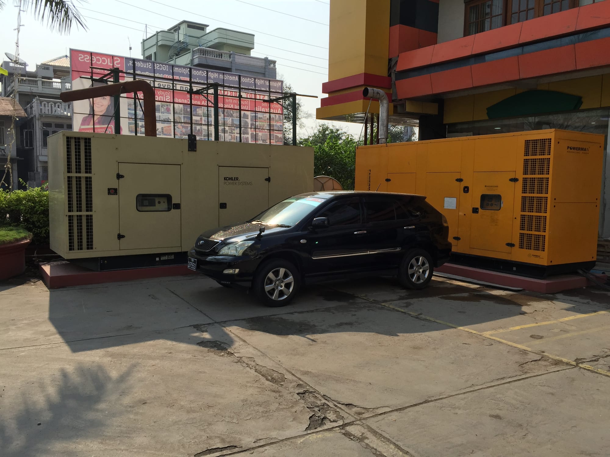 Photo by Author — emergency generators in the hotel carpark