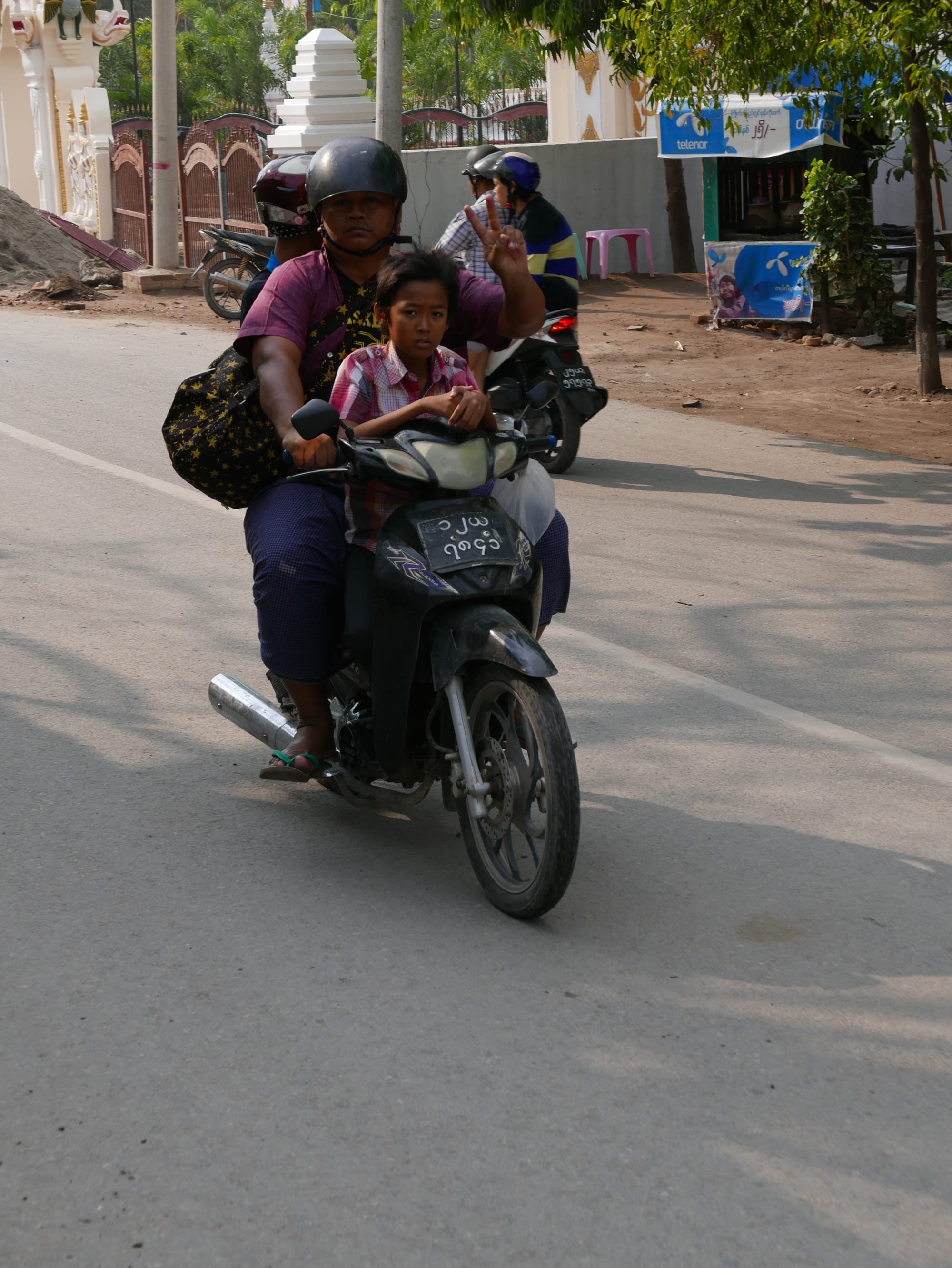 Photo by Author — three up — motorbikes of Mandalay
