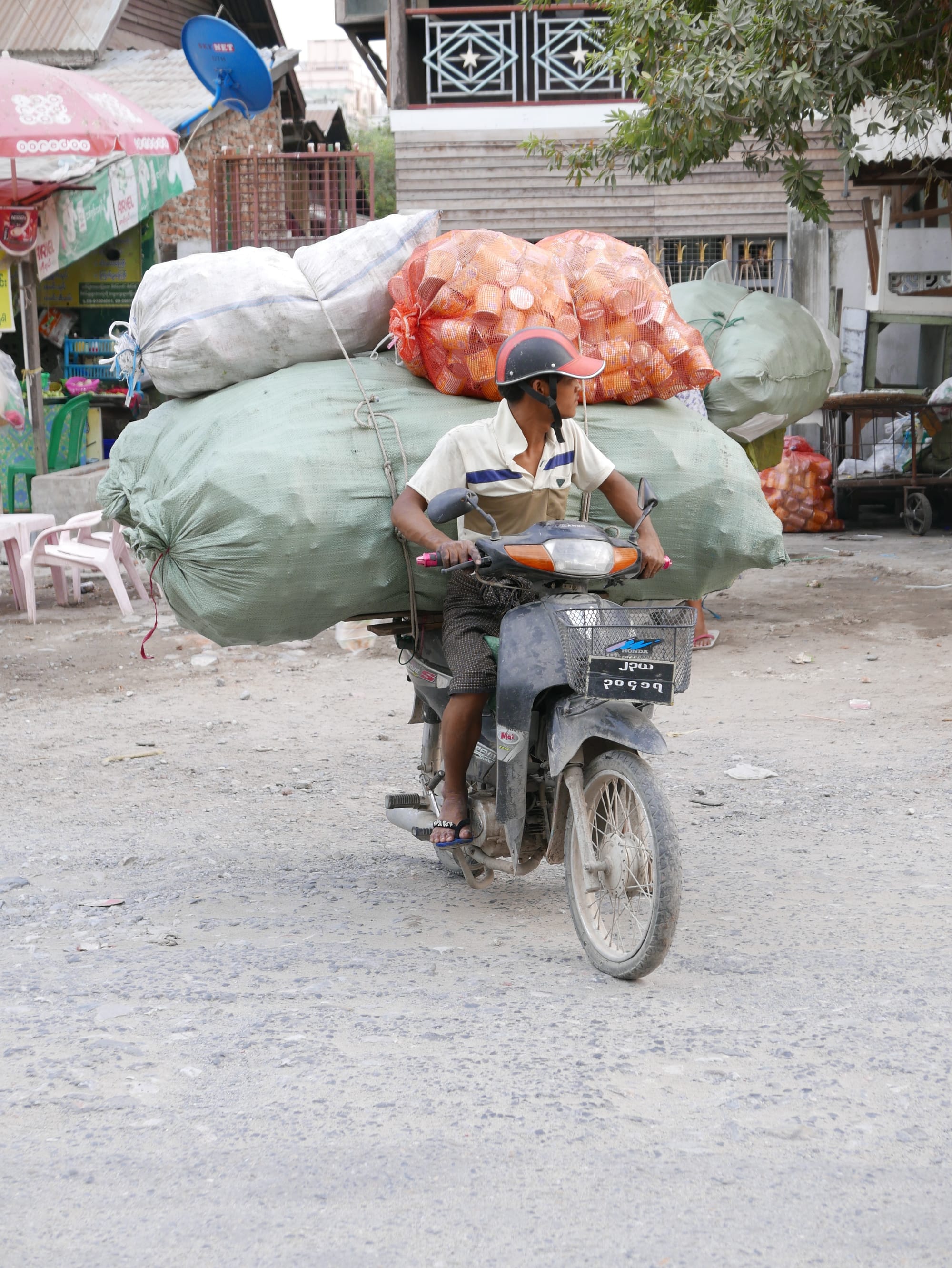 Photo by Author — small bike, big load — motorbikes of Mandalay