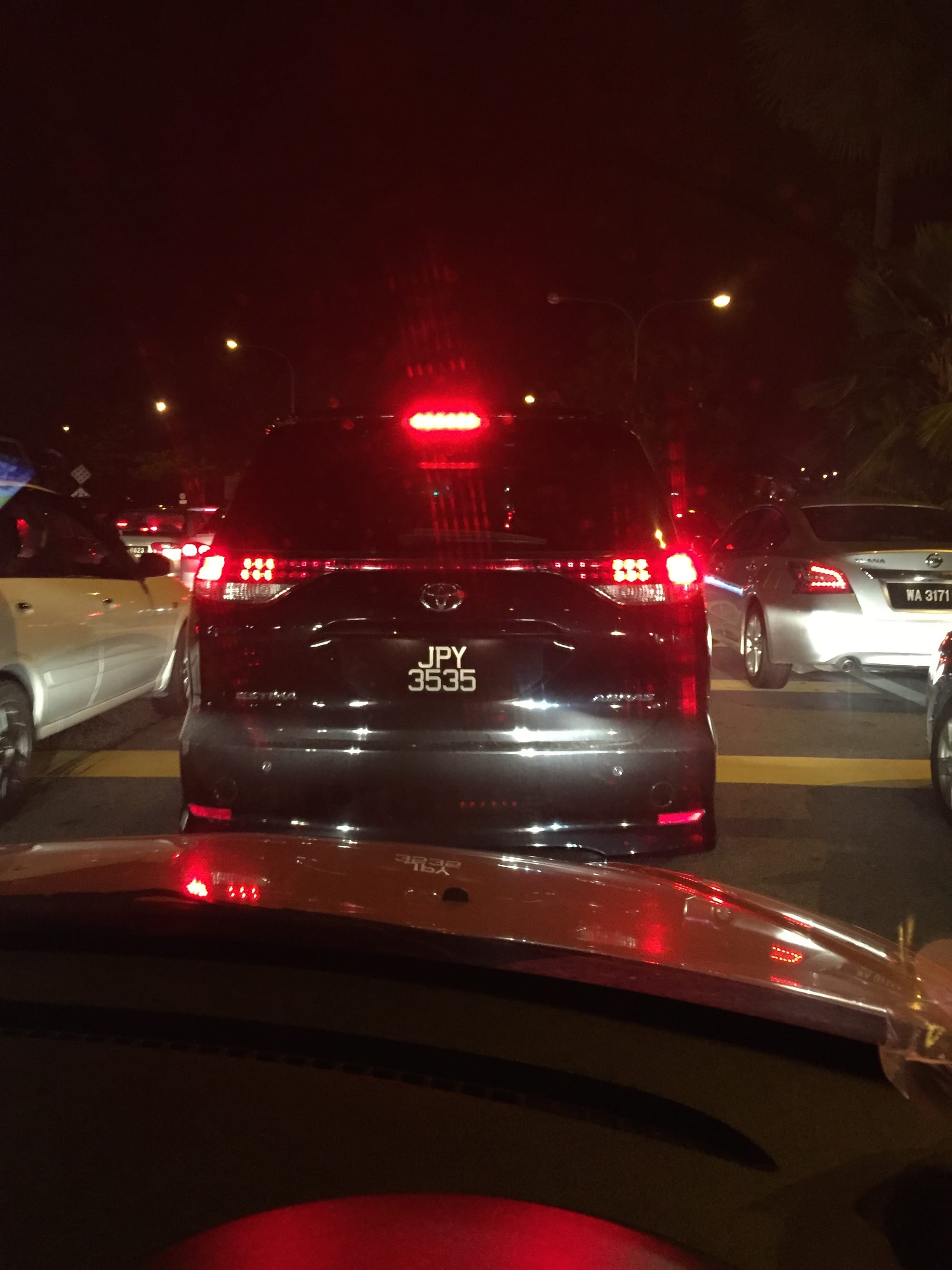 Photo by Author — just sitting in the dark, queuing at the border to get back into Malaysia