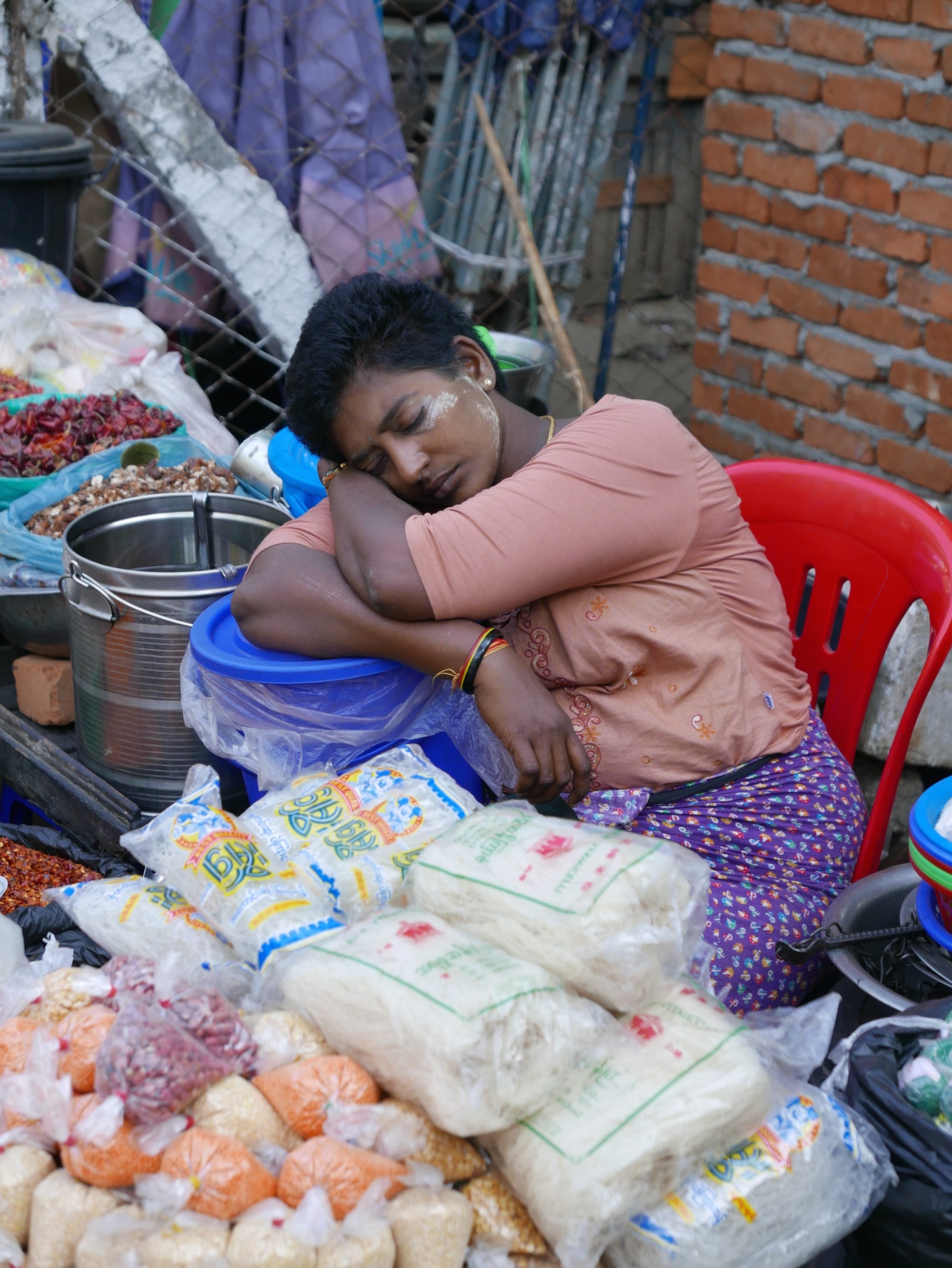Photo by Author — a napping street vendor — Myanmar (Burma)