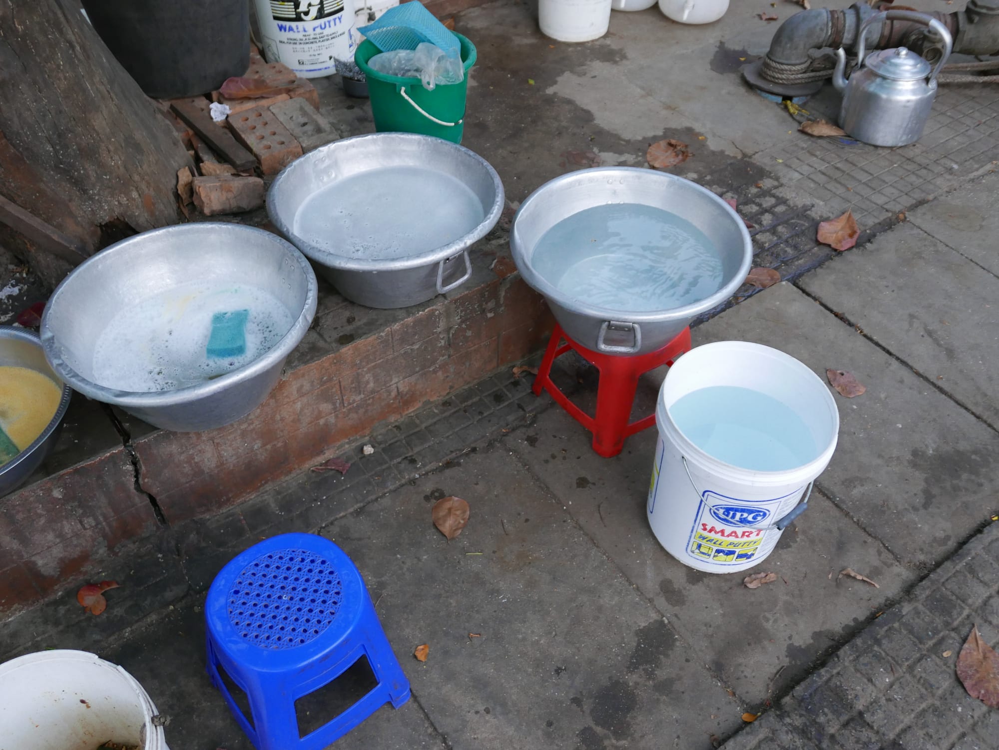 Photo by Author — the washing up area for a street food seller