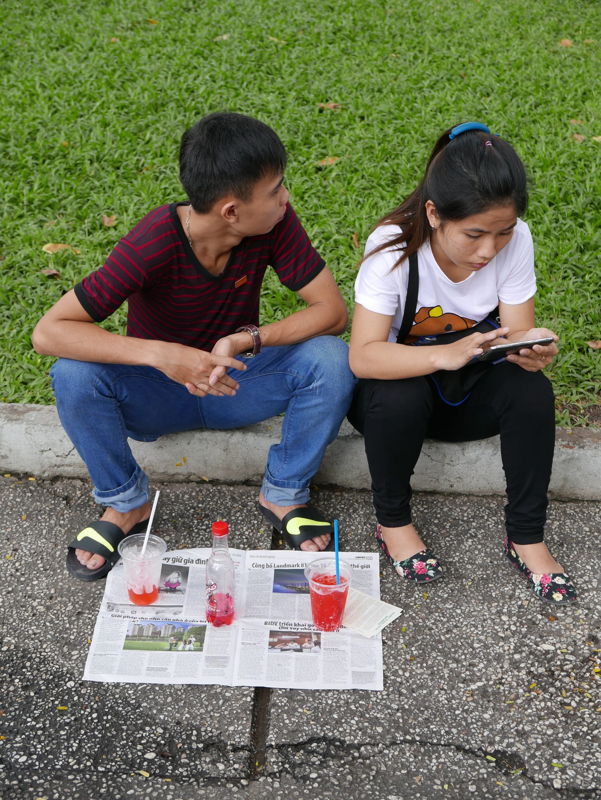 Photo by Author — a picnic on a newspaper — Sunday morning in 30-4 Park, Ho Chi Minh City (Saigon), Vietnam