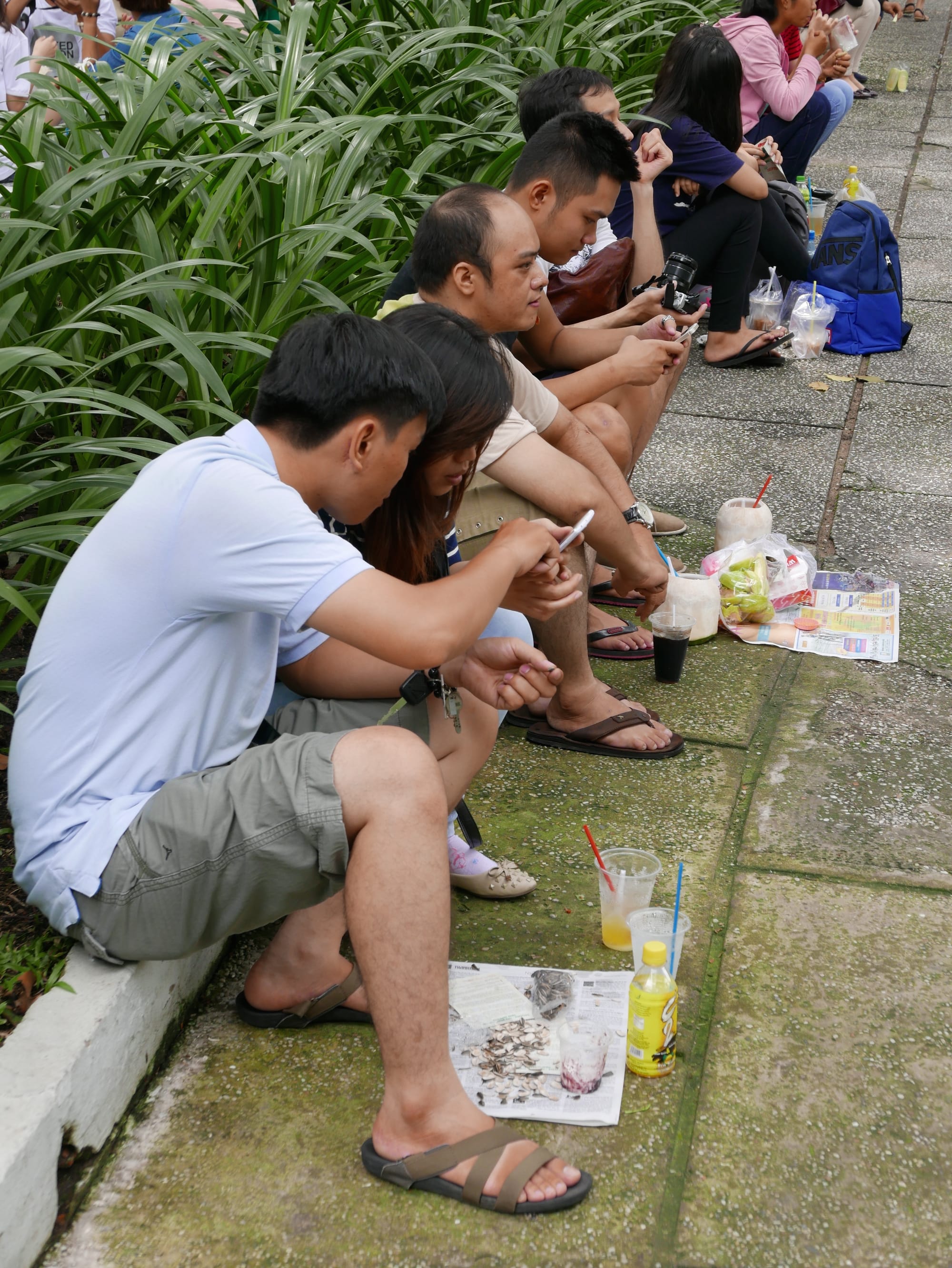 Photo by Author — a picnic on a newspaper — Sunday morning in 30-4 Park, Ho Chi Minh City (Saigon), Vietnam