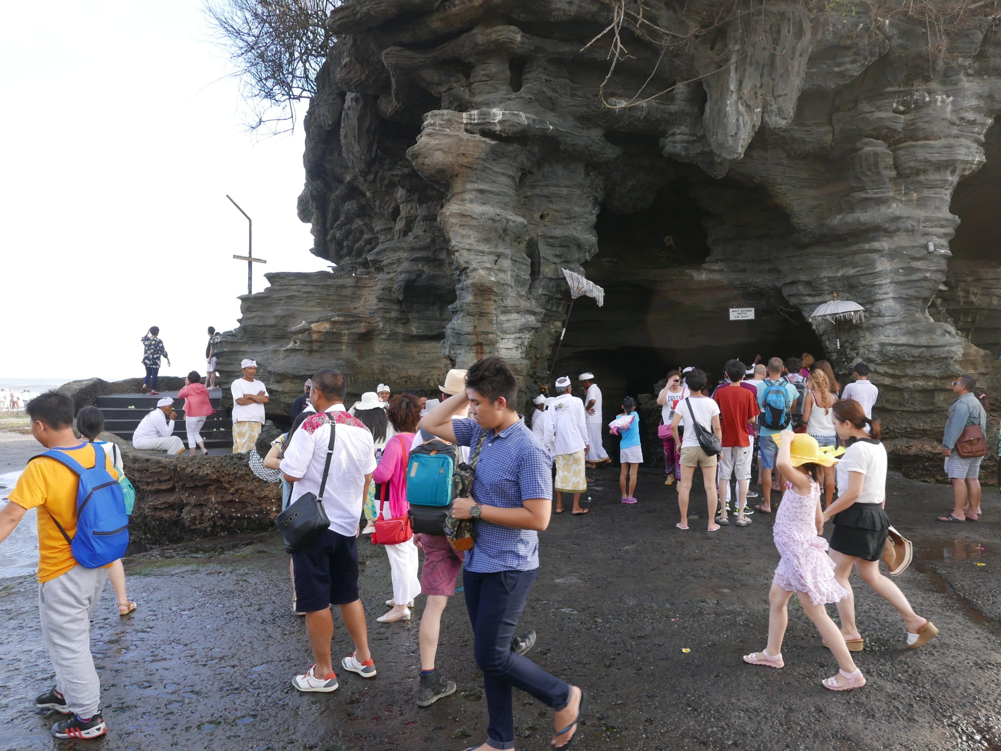 Photo by Author — being blessed at Tanah Lot, Bali, Indonesia