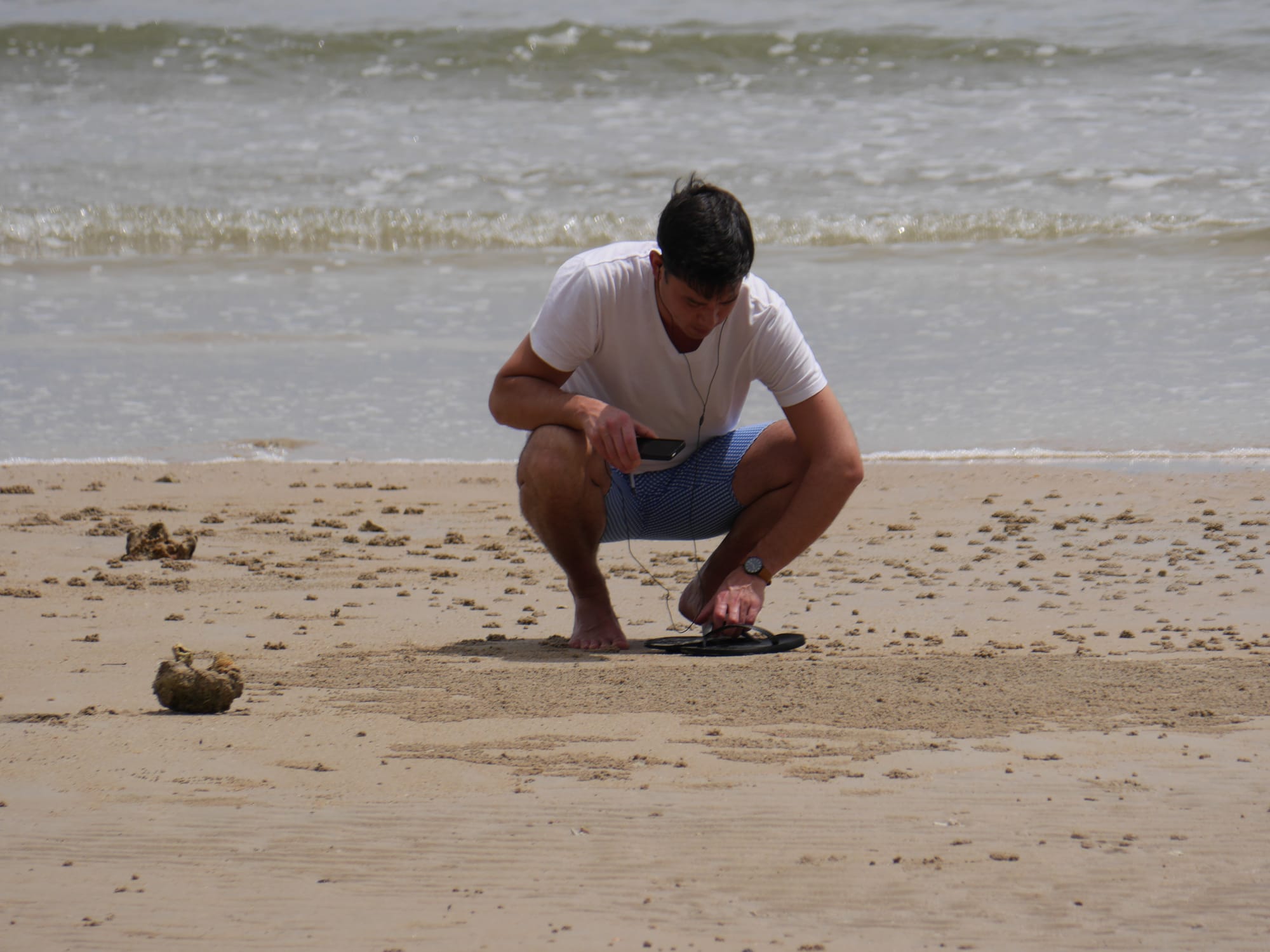 Photo by Author —looking for crabs on the beach at the Andaman Hotel, Langkawi, Malaysia