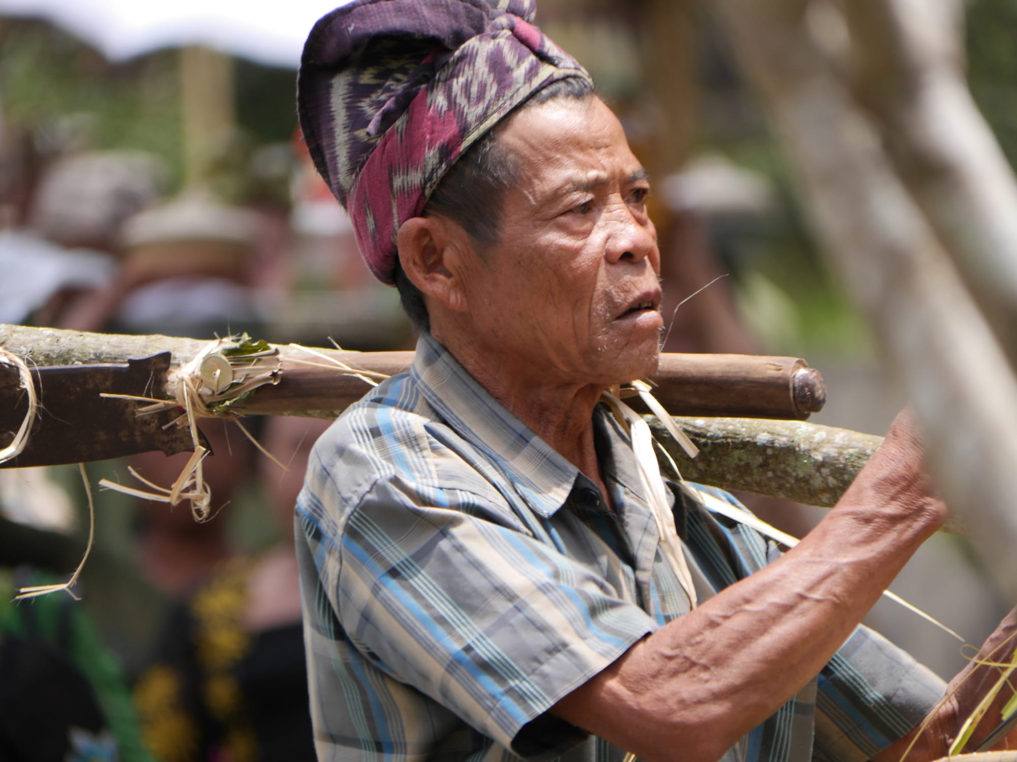 Photo by Author — a mourner at a cremation procession in Bali