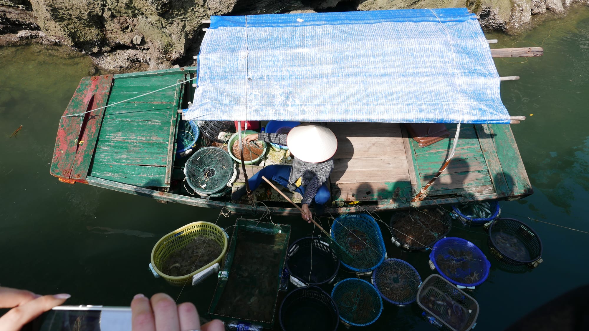 Photo by Author — a floating seller — Ha Long Bay, Vietnam