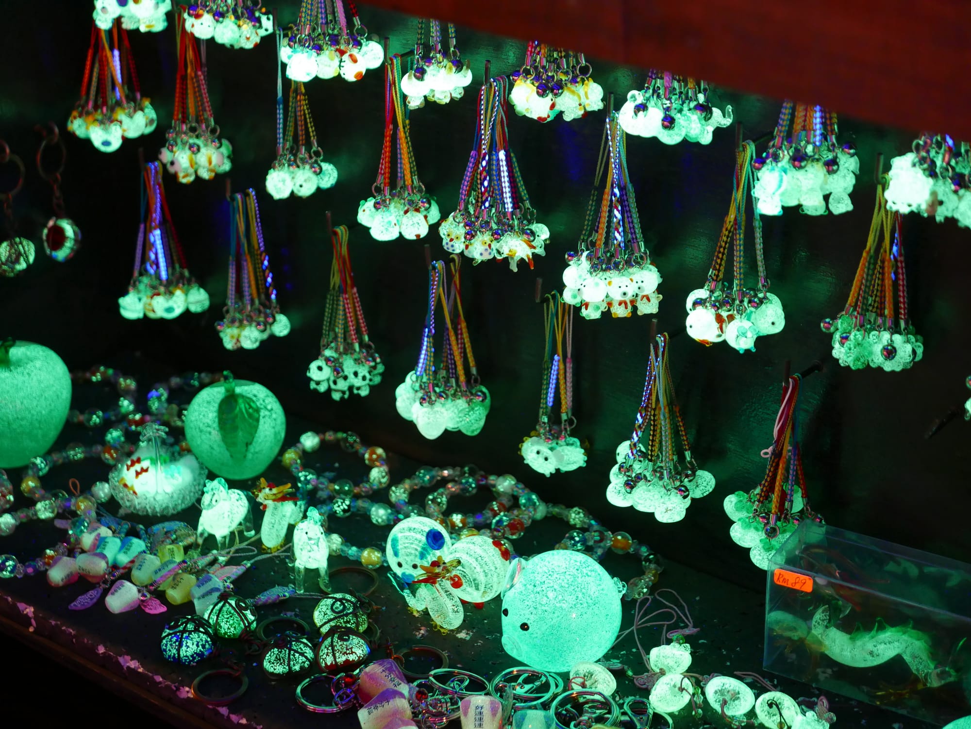 Photo by Author — glowing trinket — Night Market, Malacca, Malaysia