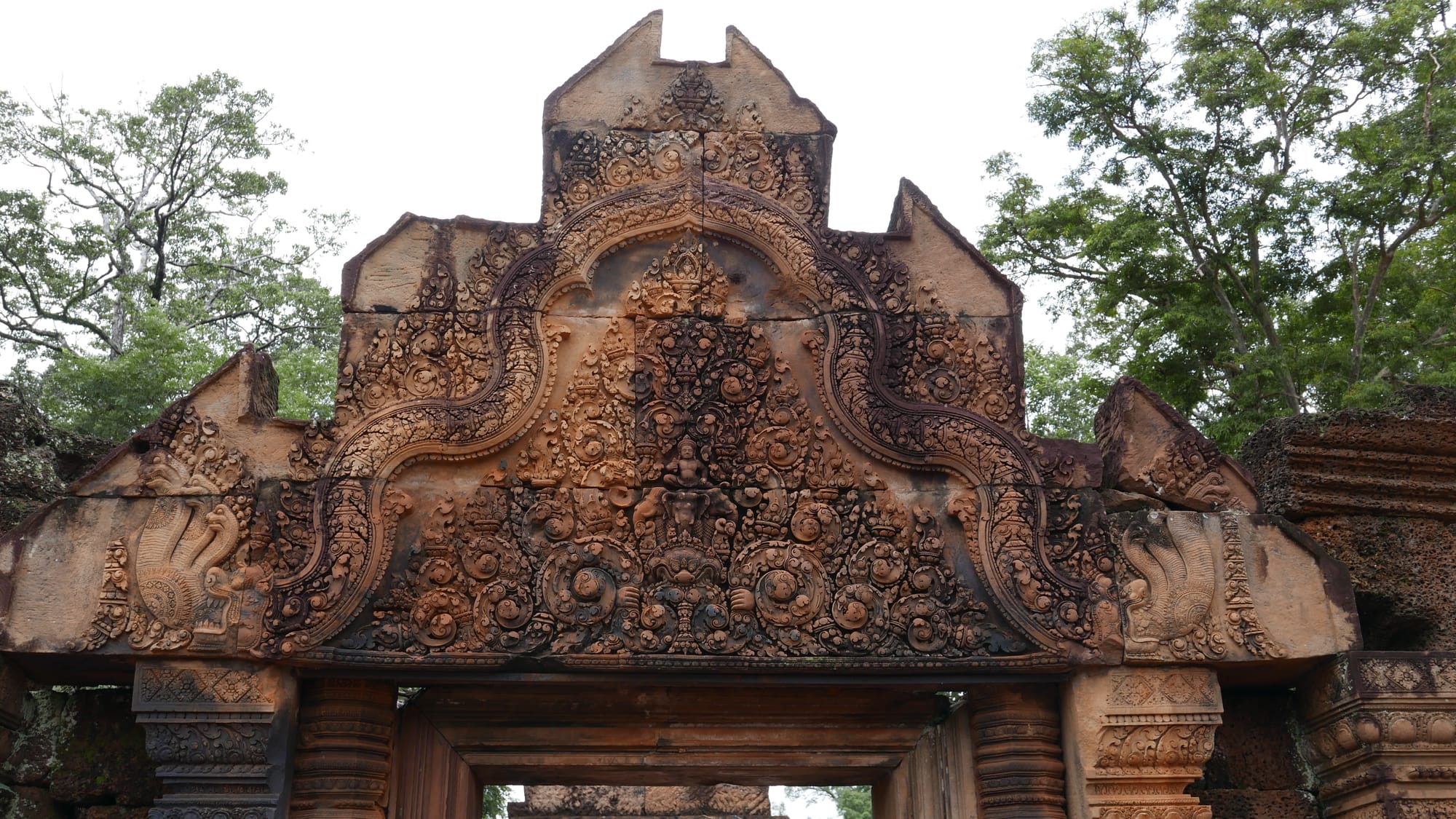 Photo by Author — stunning stonework above the doorway — Banteay Srei Temple (ប្រាសាទបន្ទាយស្រី), Angkor Archaeological Park, Angkor, Cambodia