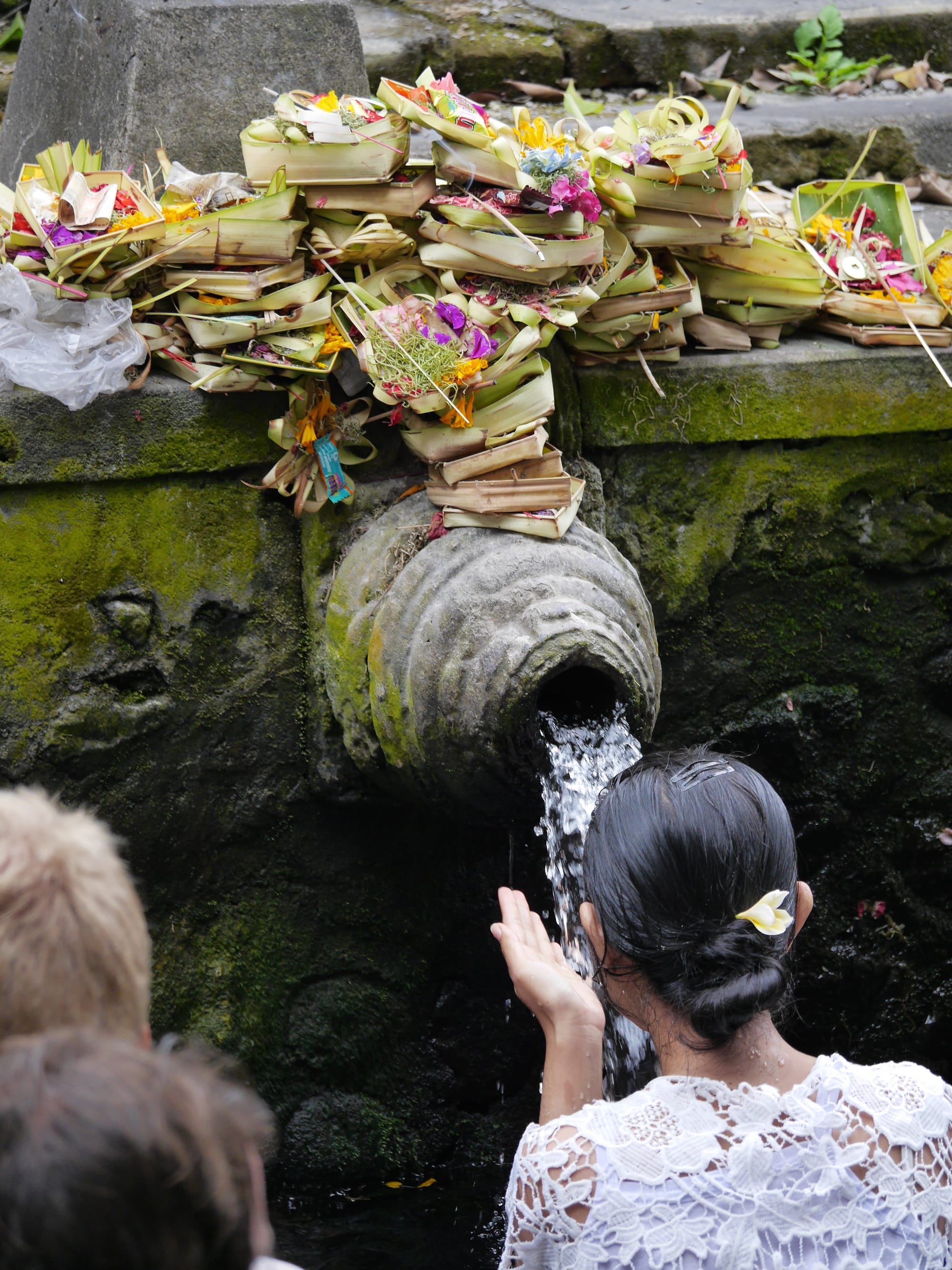 Photo by Author — offerings at the bathing pools — Pura Tirta Empul (Tirta Empul Temple), Bali, Indonesia