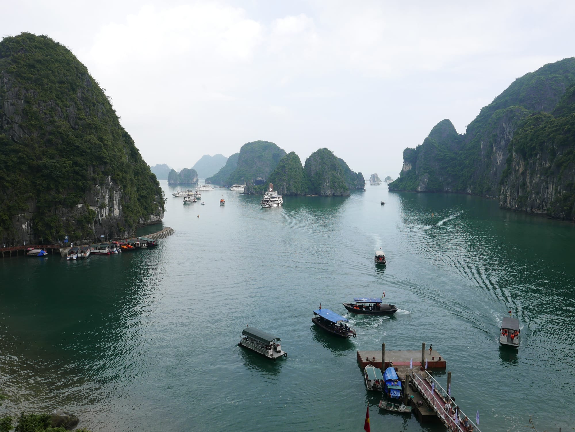 Photo by Author — tourist boats moored up at The Surprise Cave, Ha Long Bay, Vietnam