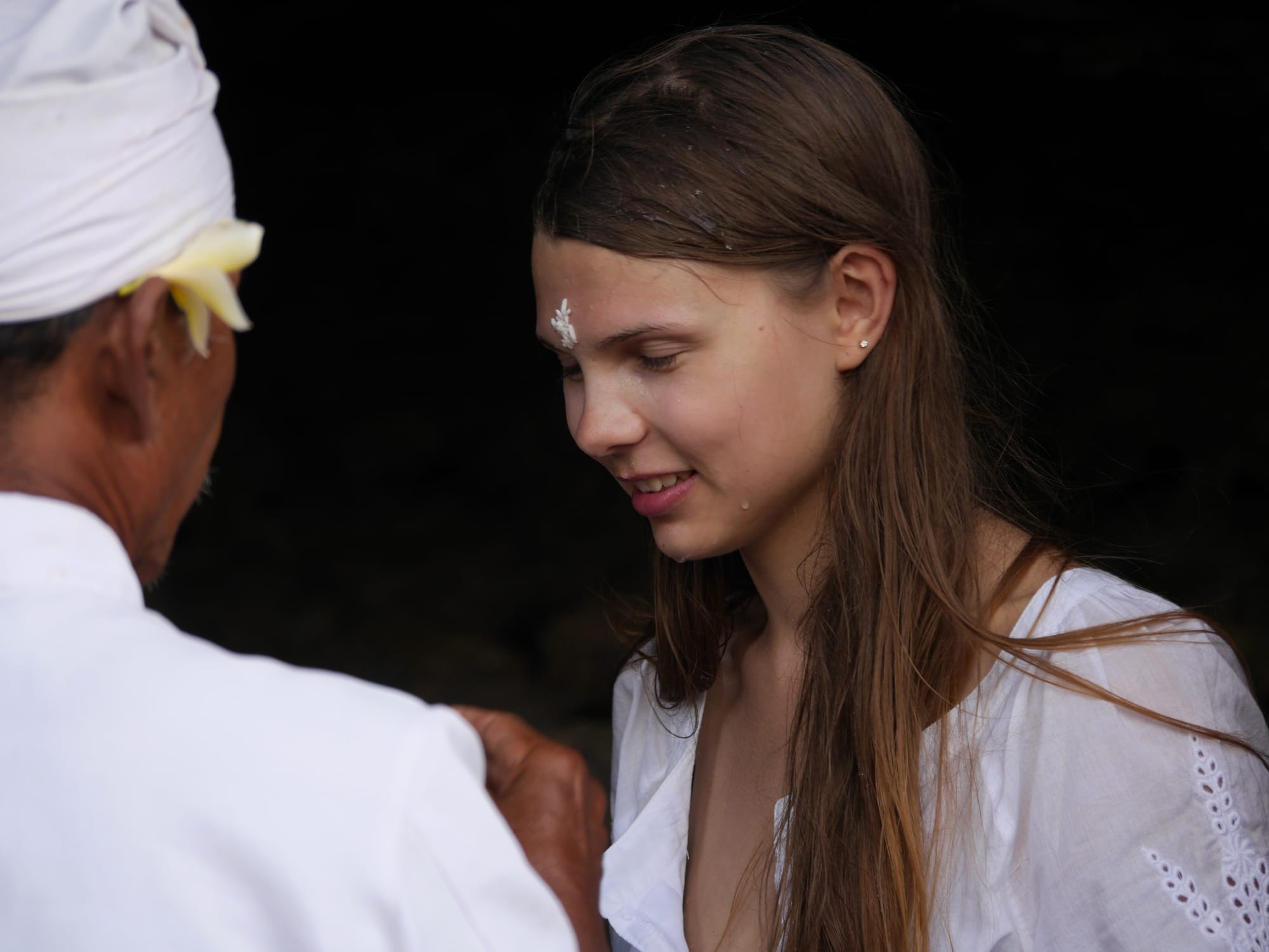 Photo by Author — blessing at Tanah Lot, Bali, Indonesia