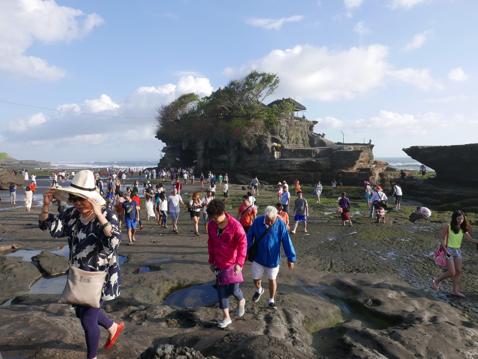 Photo by Author — tourists at Tanah Lot, Bali, Indonesia