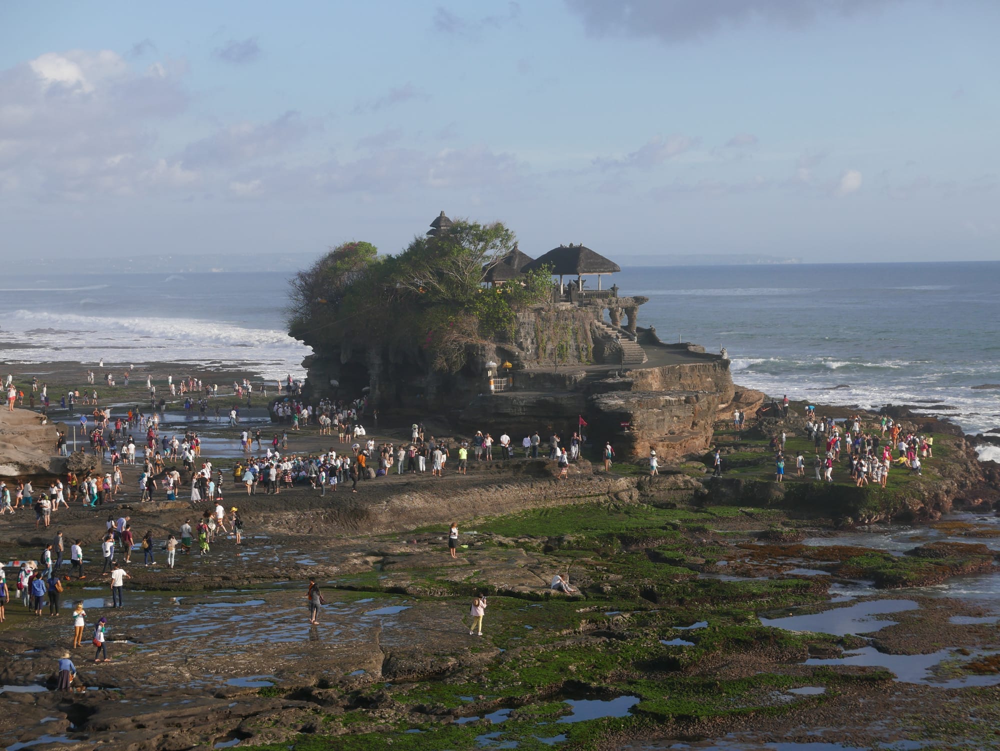 Photo by Author — tourists on the beach at Tanah Lot, Bali, Indonesia