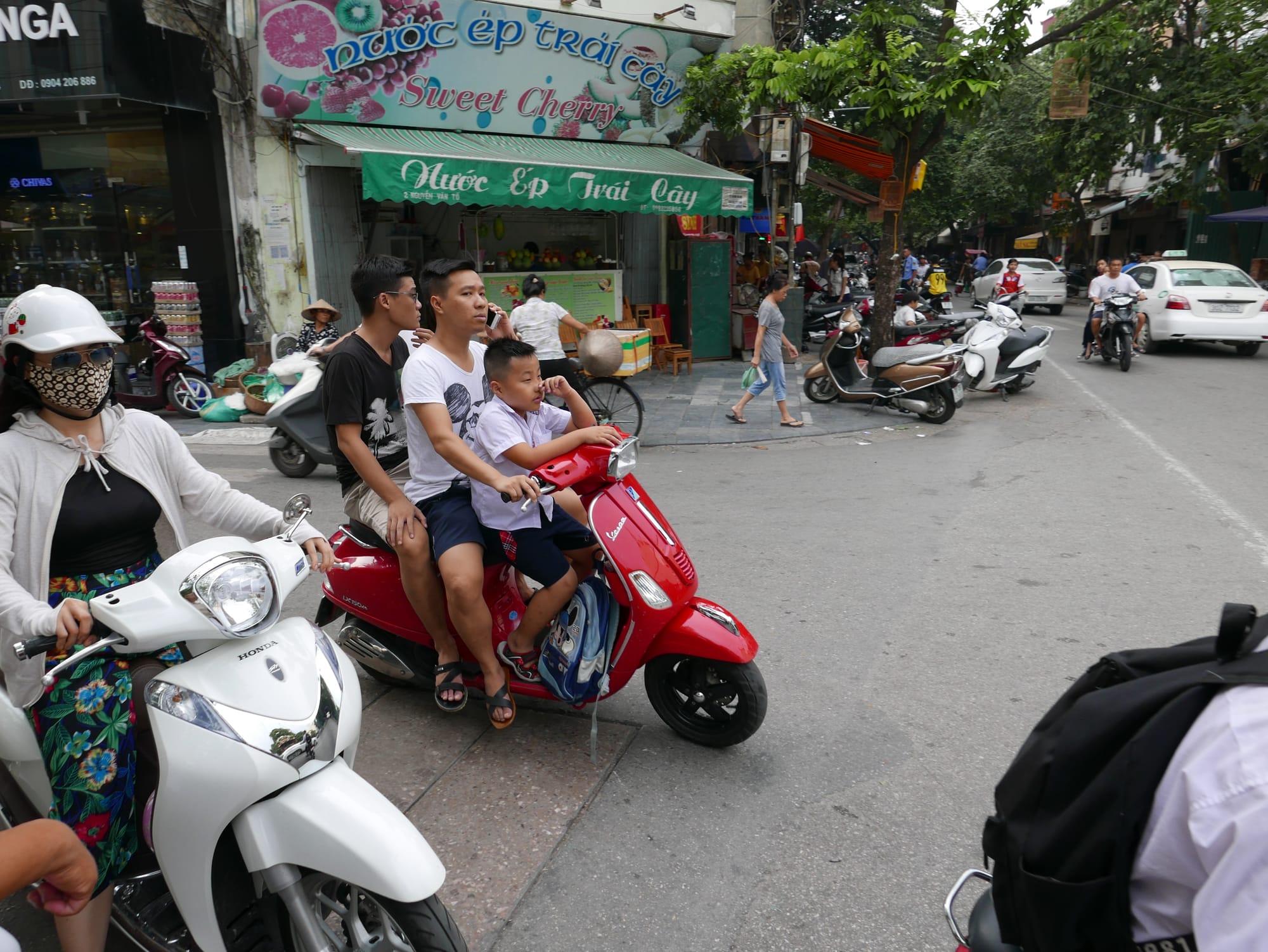 Photo by Author — a family out on a motorbike in Hanoi, Vietnam