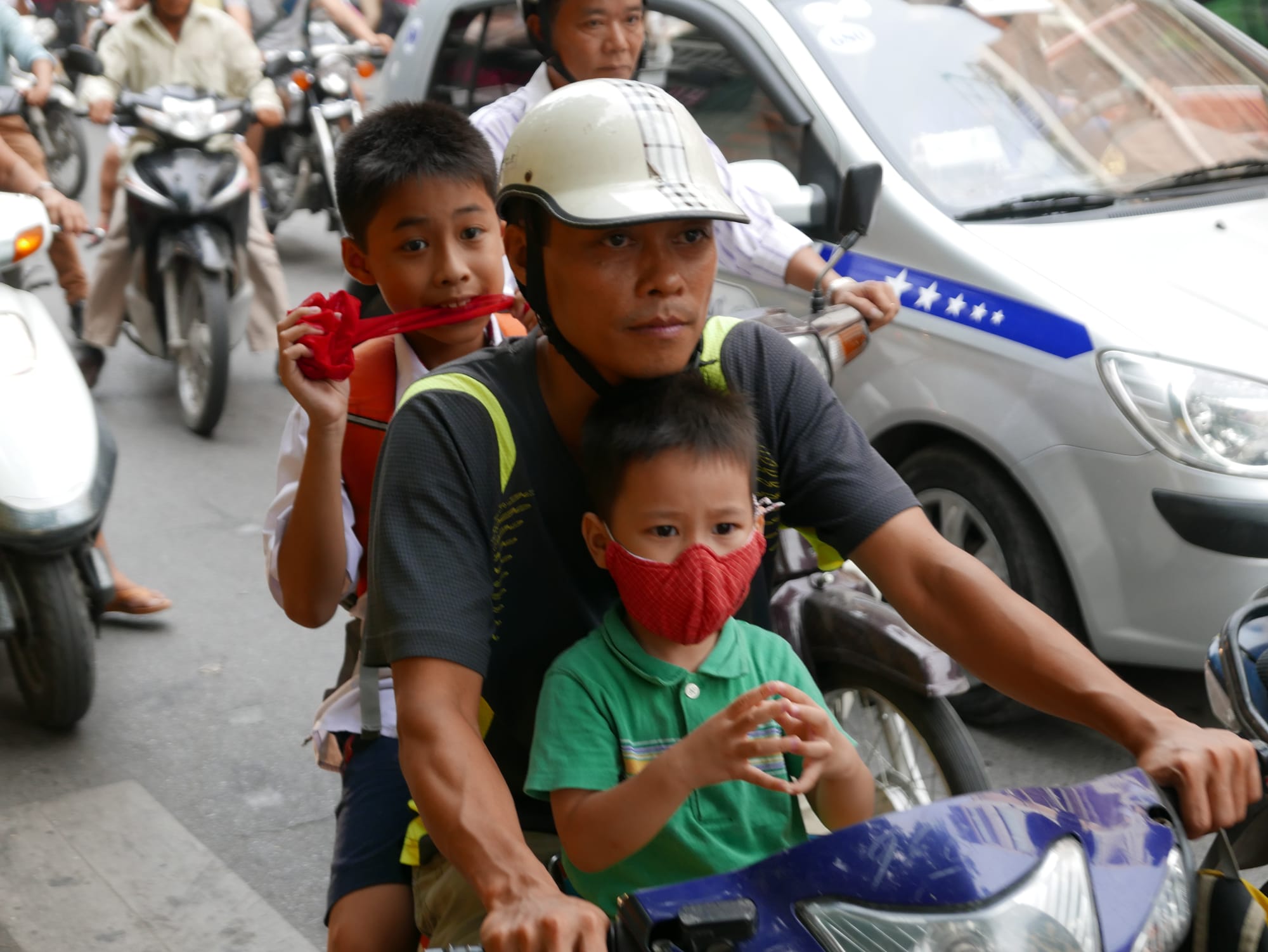 Photo by Author — a family out on a motorbike in Hanoi, Vietnam