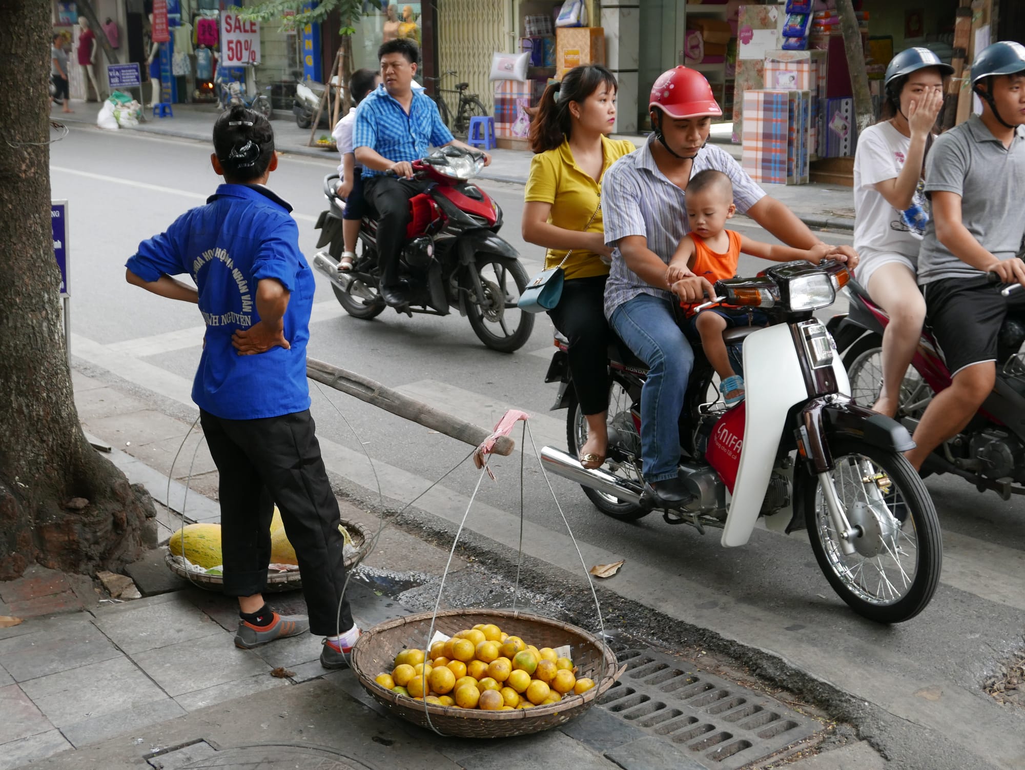 Photo by Author — waiting to cross the road — motorbikes of Hanoi, Vietnam