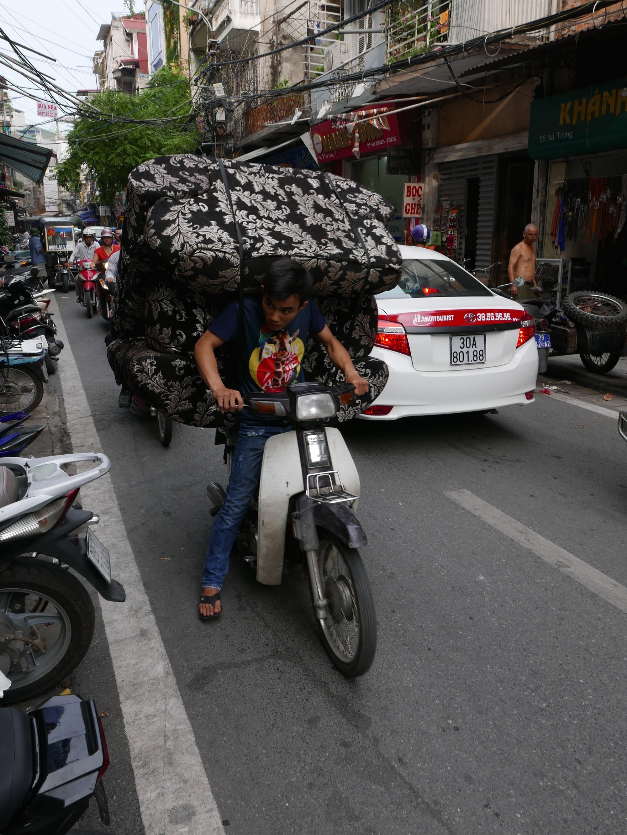 Photo by Author — heavy load — motorbikes of Hanoi, Vietnam