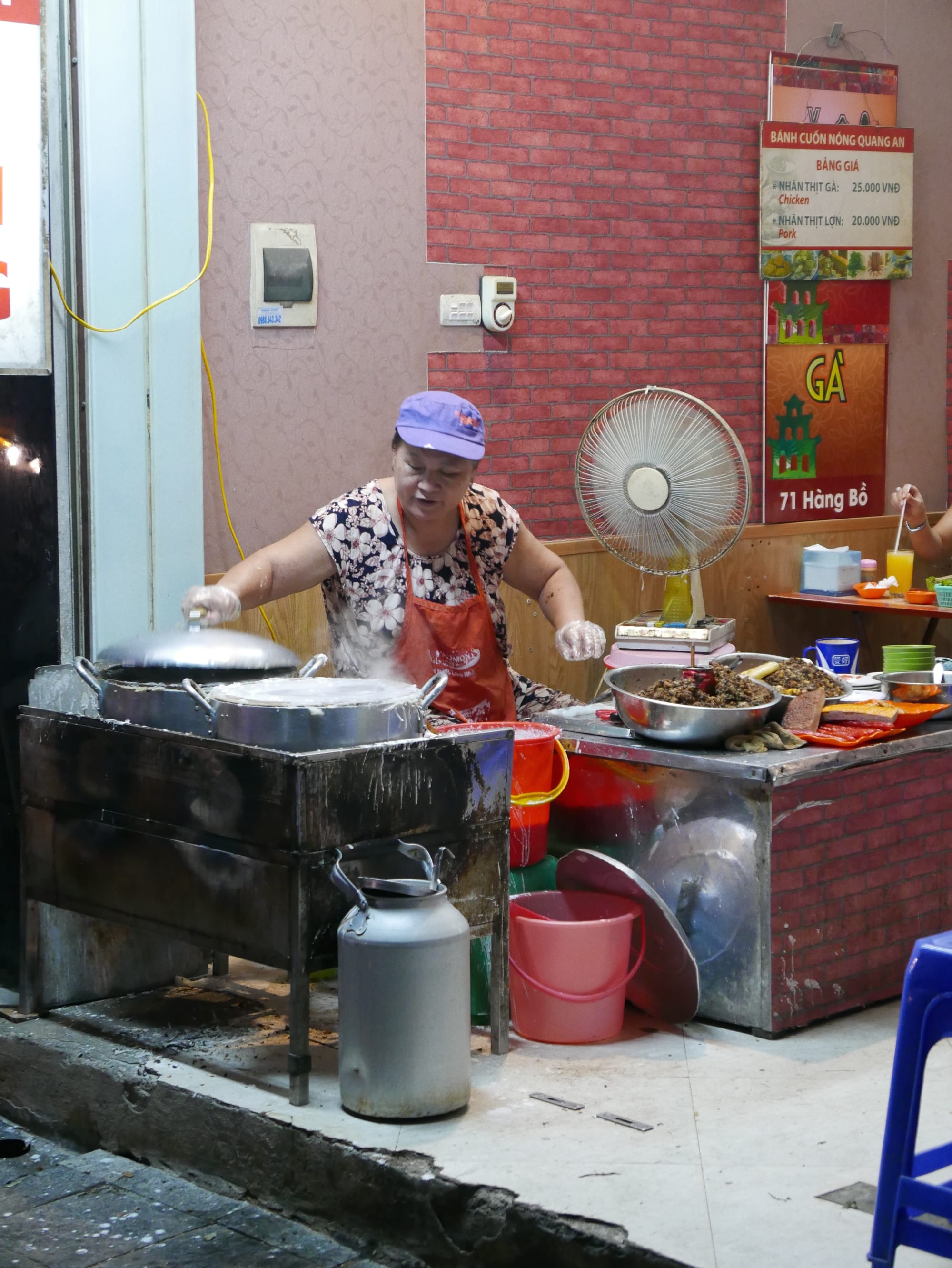 Photo by Author — cooking on the street — Hanoi, Vietnam