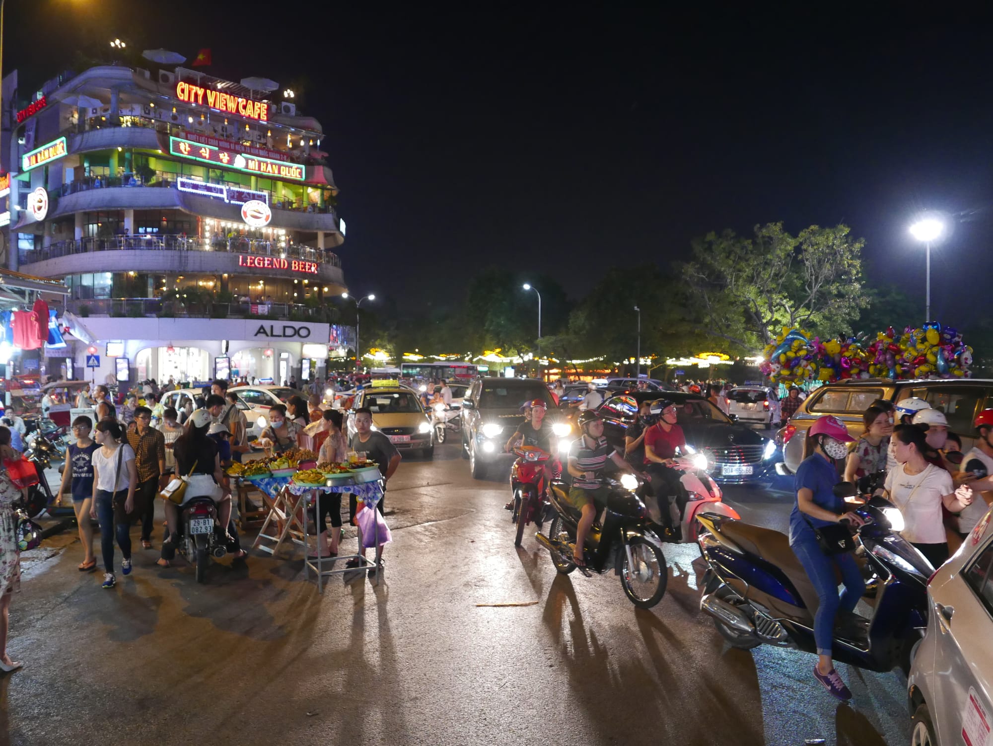 Photo by Author — late-night traffic and market — Hanoi, Vietnam