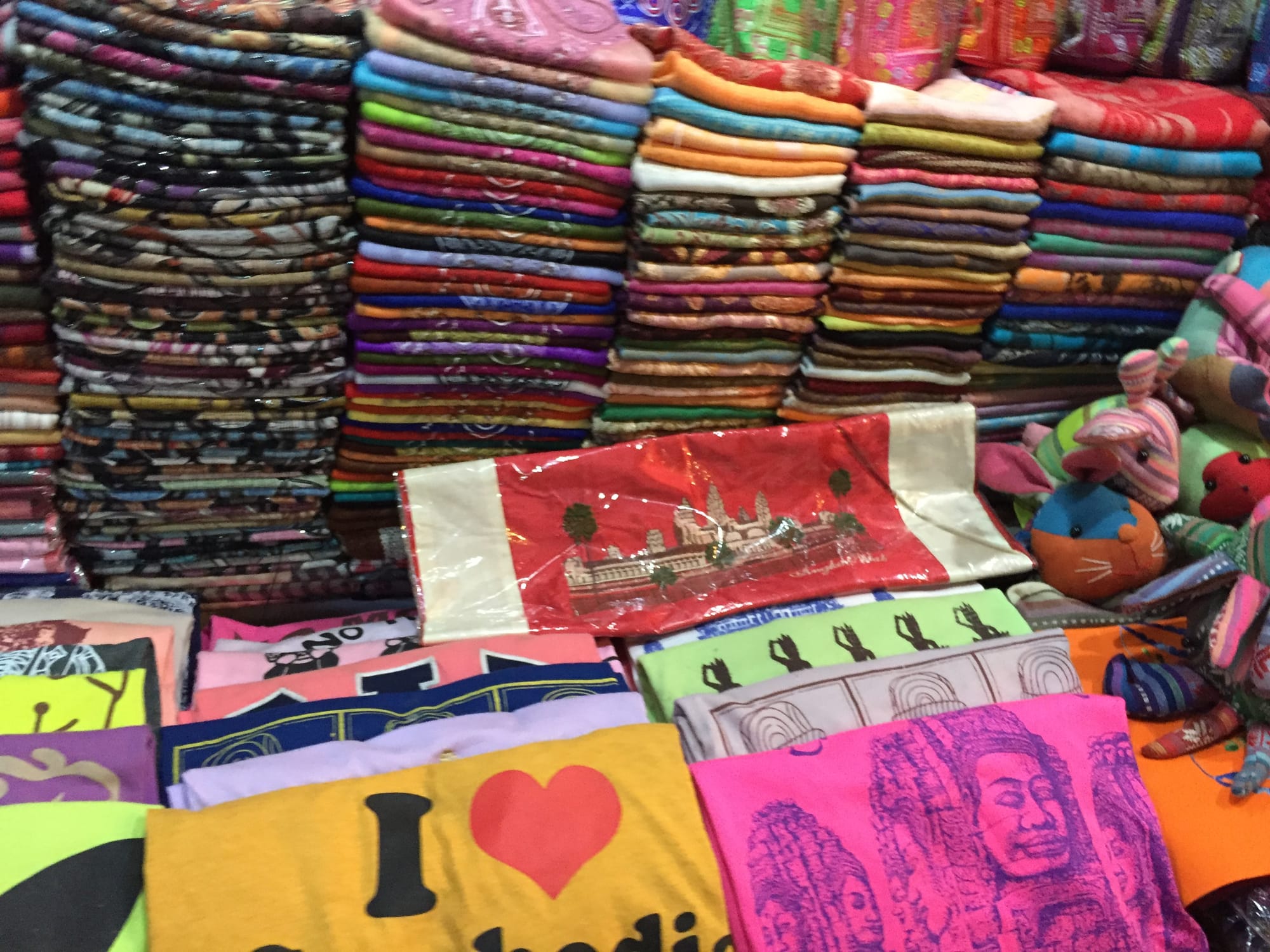 Photo by Author — t-shirts for sale at the Art Centre Night Market, Siem Reap, Cambodia