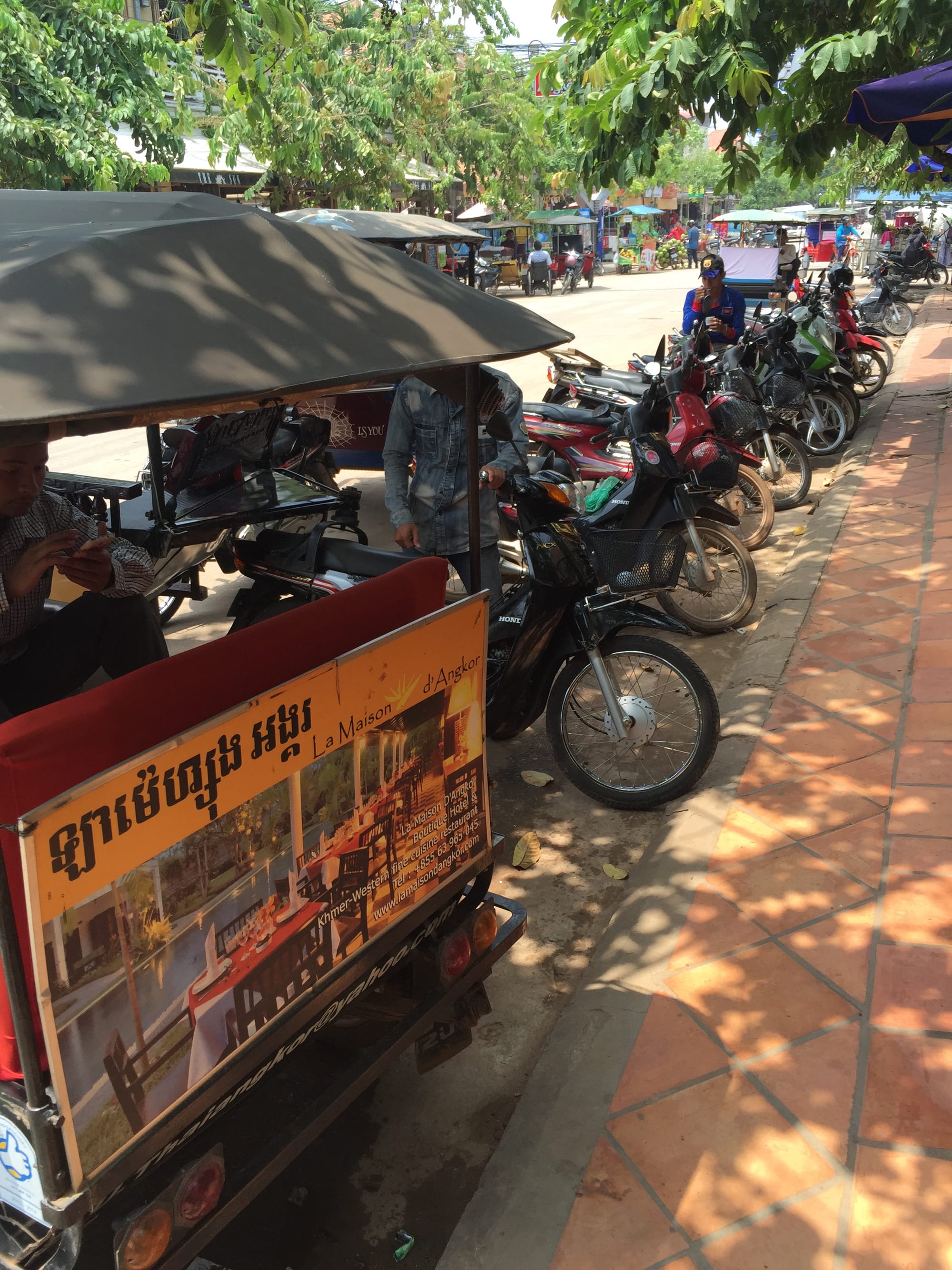 Photo by Author — motorbike park at the local market — Siem Reap, Cambodia