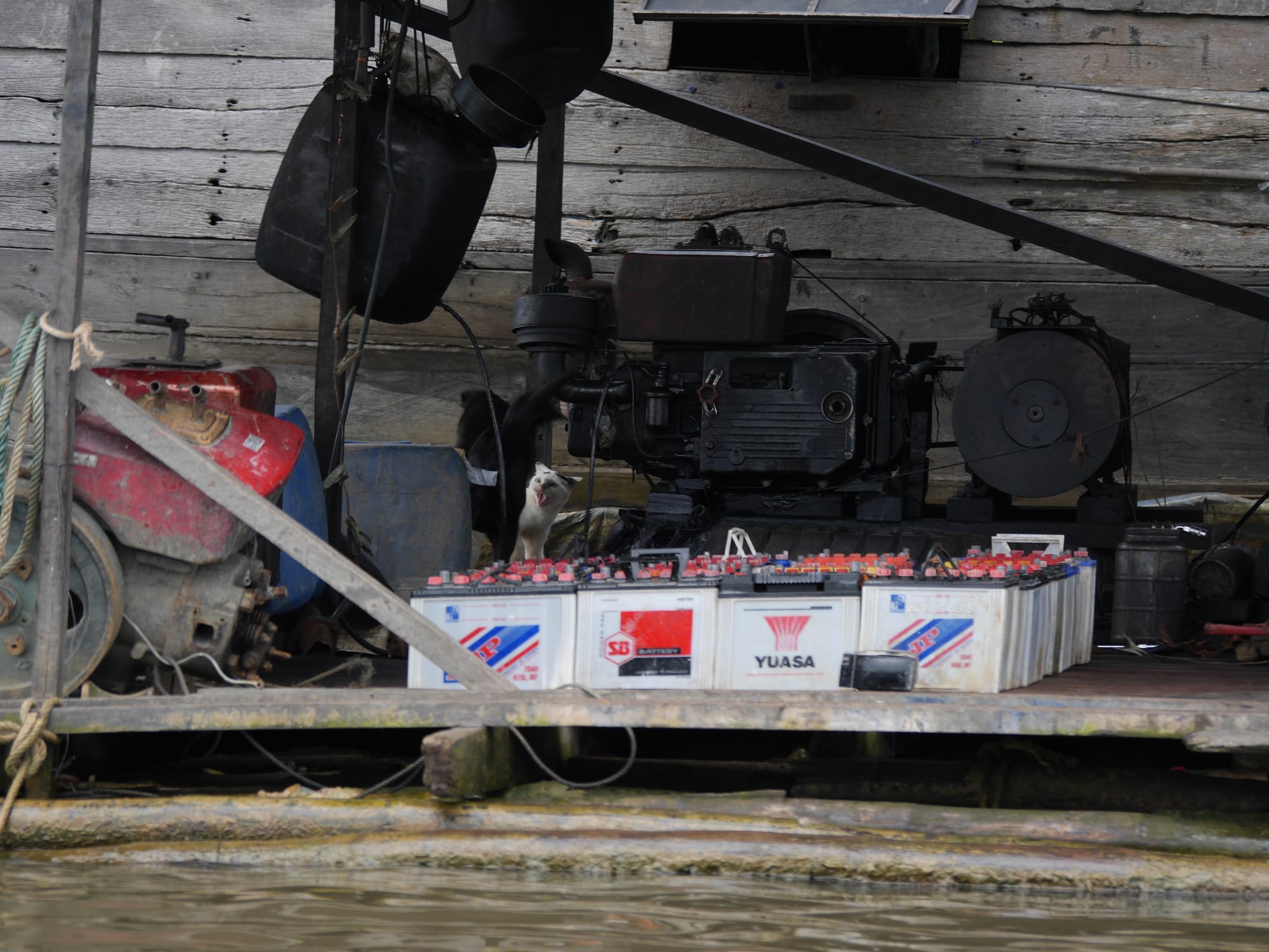 Photo by Author — electricity supply from batteries — Mechrey Floating Village, Siem Reap, Cambodia