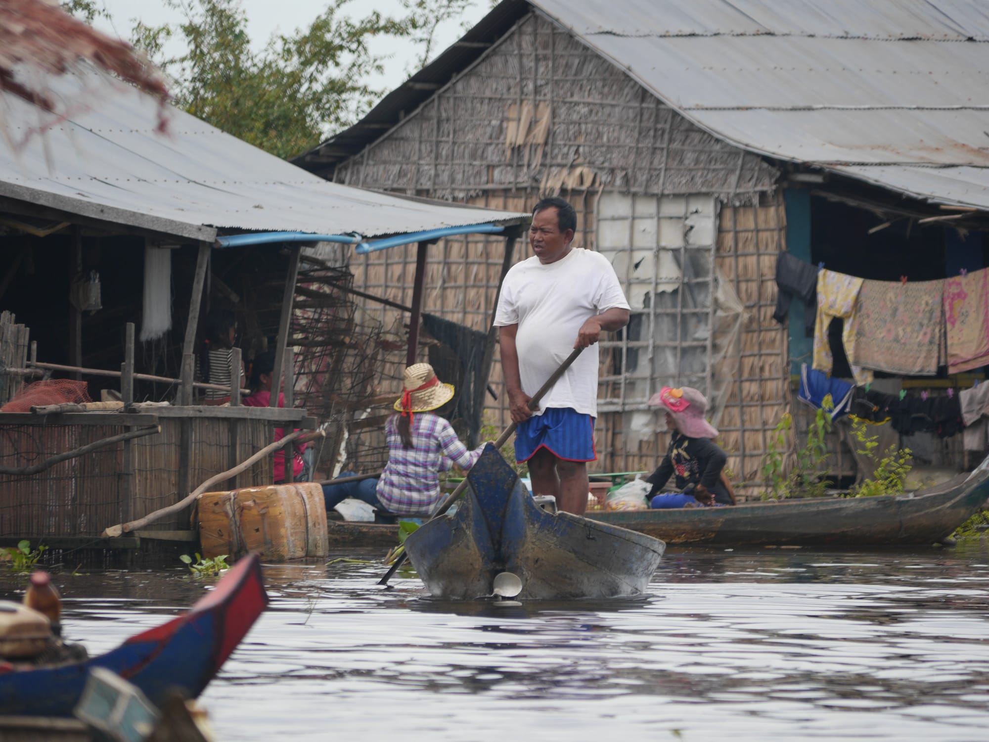 Photo by Author — locals moving around the village — Mechrey Floating Village, Siem Reap, Cambodia