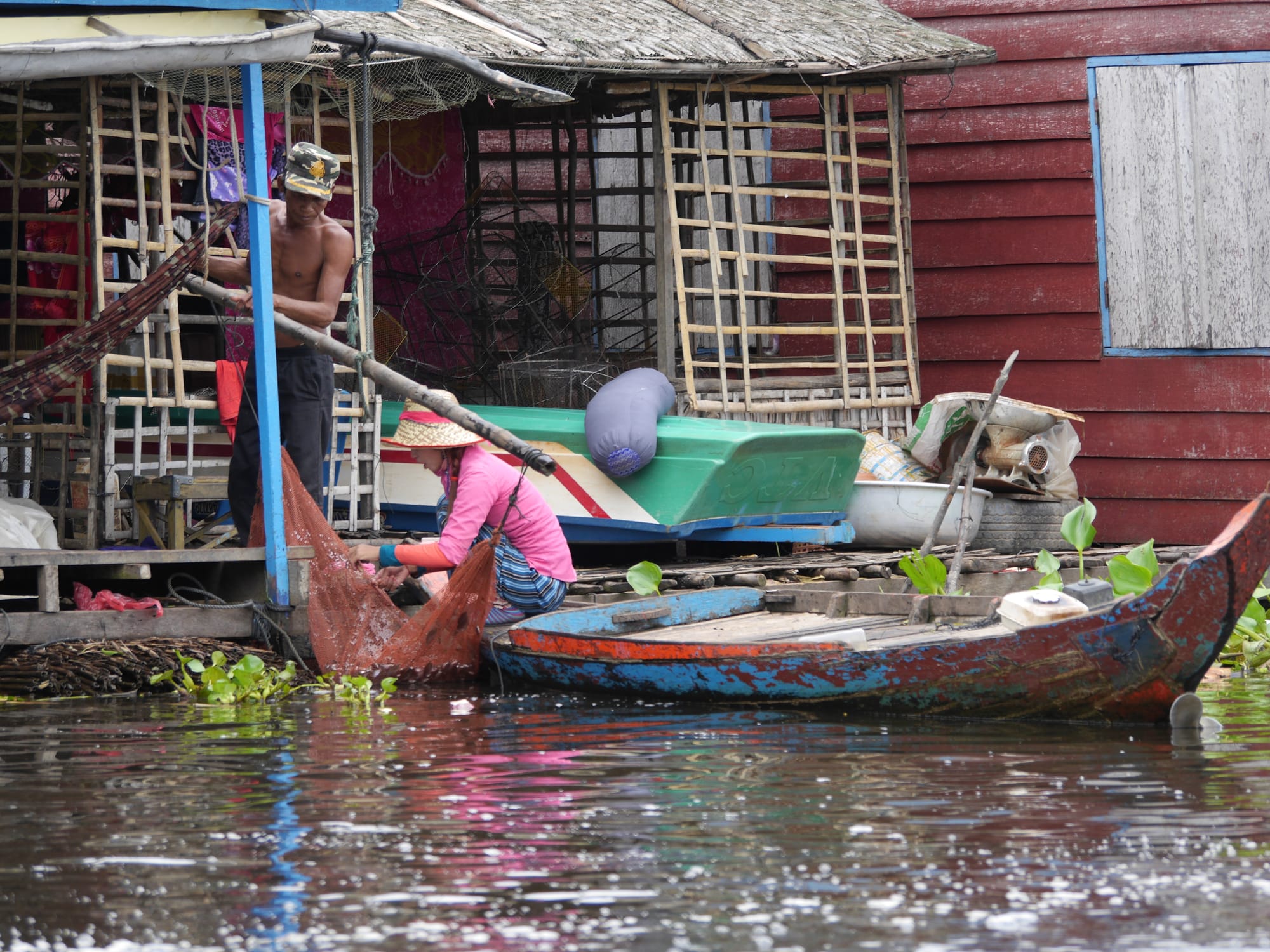 Photo by Author — washing the catch — Mechrey Floating Village, Siem Reap, Cambodia