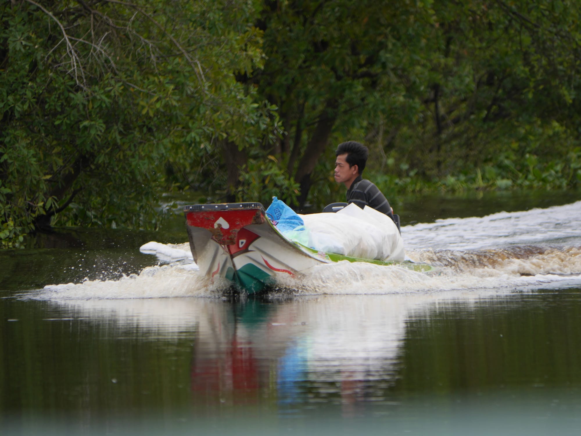 Photo by Author — a speeding boat — Mechrey Floating Village, Siem Reap, Cambodia