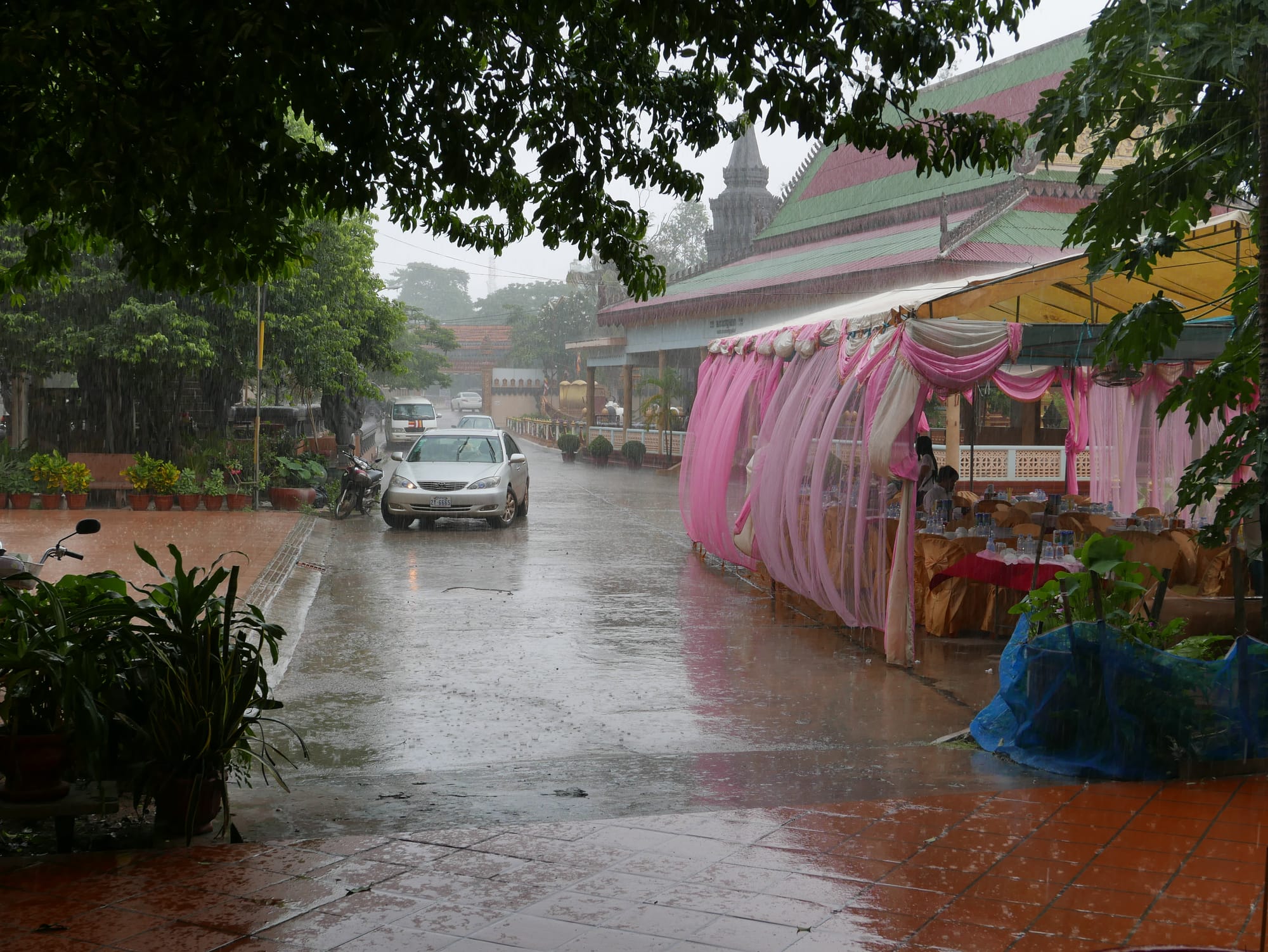 Photo by Author — and the rain came down — Wat Preah Prohm Rath (Wat Preah Prom Rath), Pokambor Avenue, Siem Reap, Cambodia