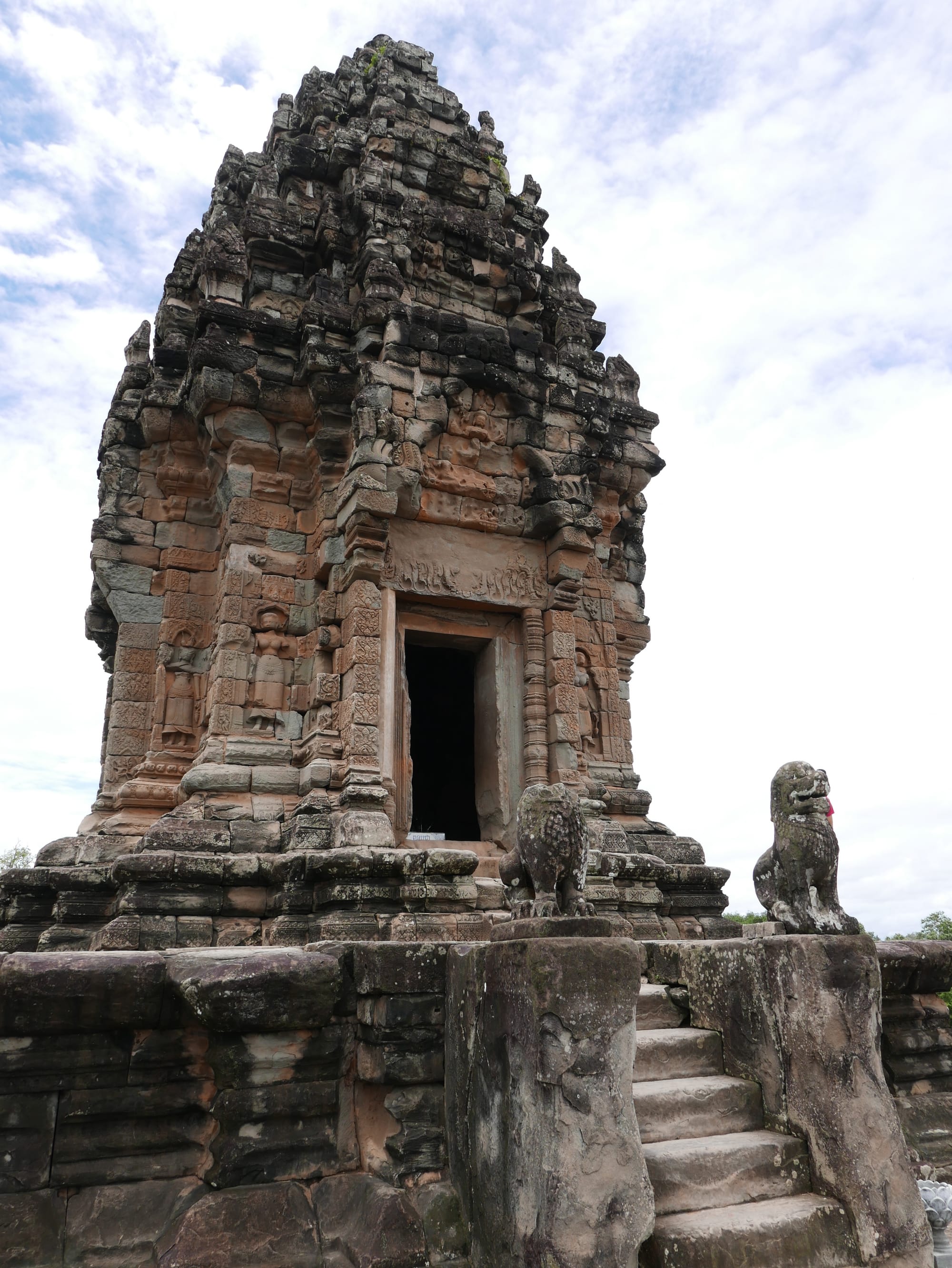 Photo by Author — central tower at Bakong Temple (បាគង), Angkor Archaeological Park, Angkor, Cambodia, with guardian lions