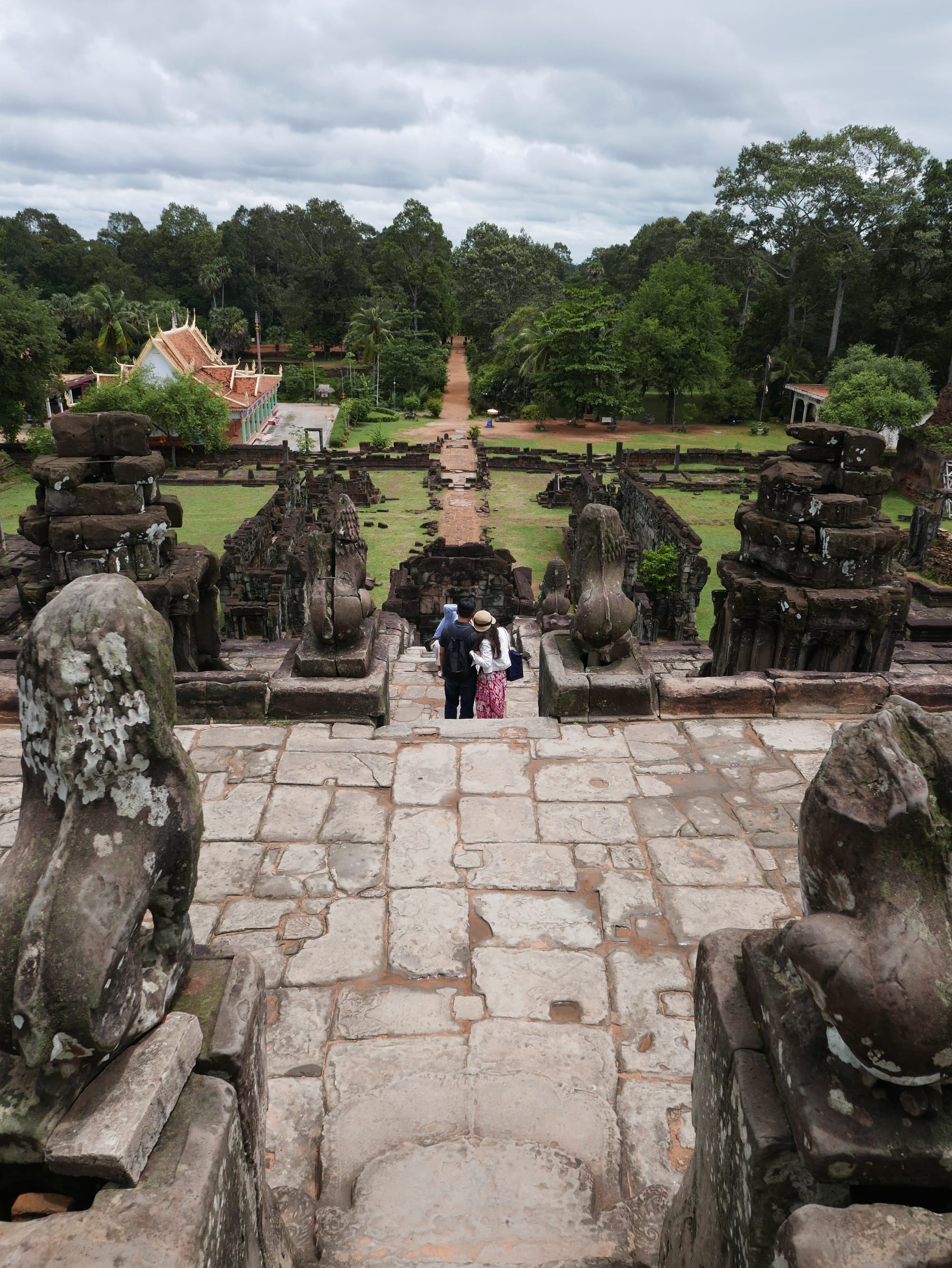 Photo by Author — the view back down to the temple precinct from the central tower at Bakong Temple (បាគង), Angkor Archaeological Park, Angkor, Cambodia