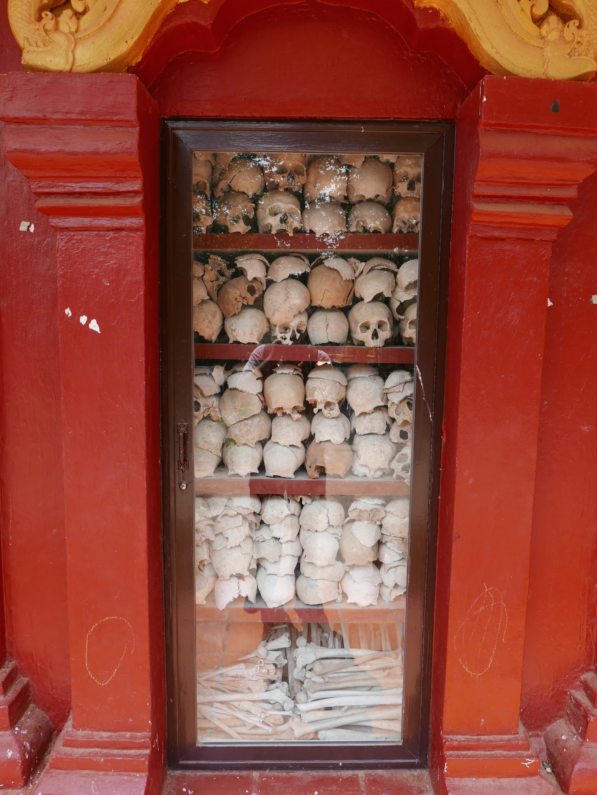 Photo by Author — human skulls at the Wat Thmey Killing Field Memorial, Siem Reap, Cambodia