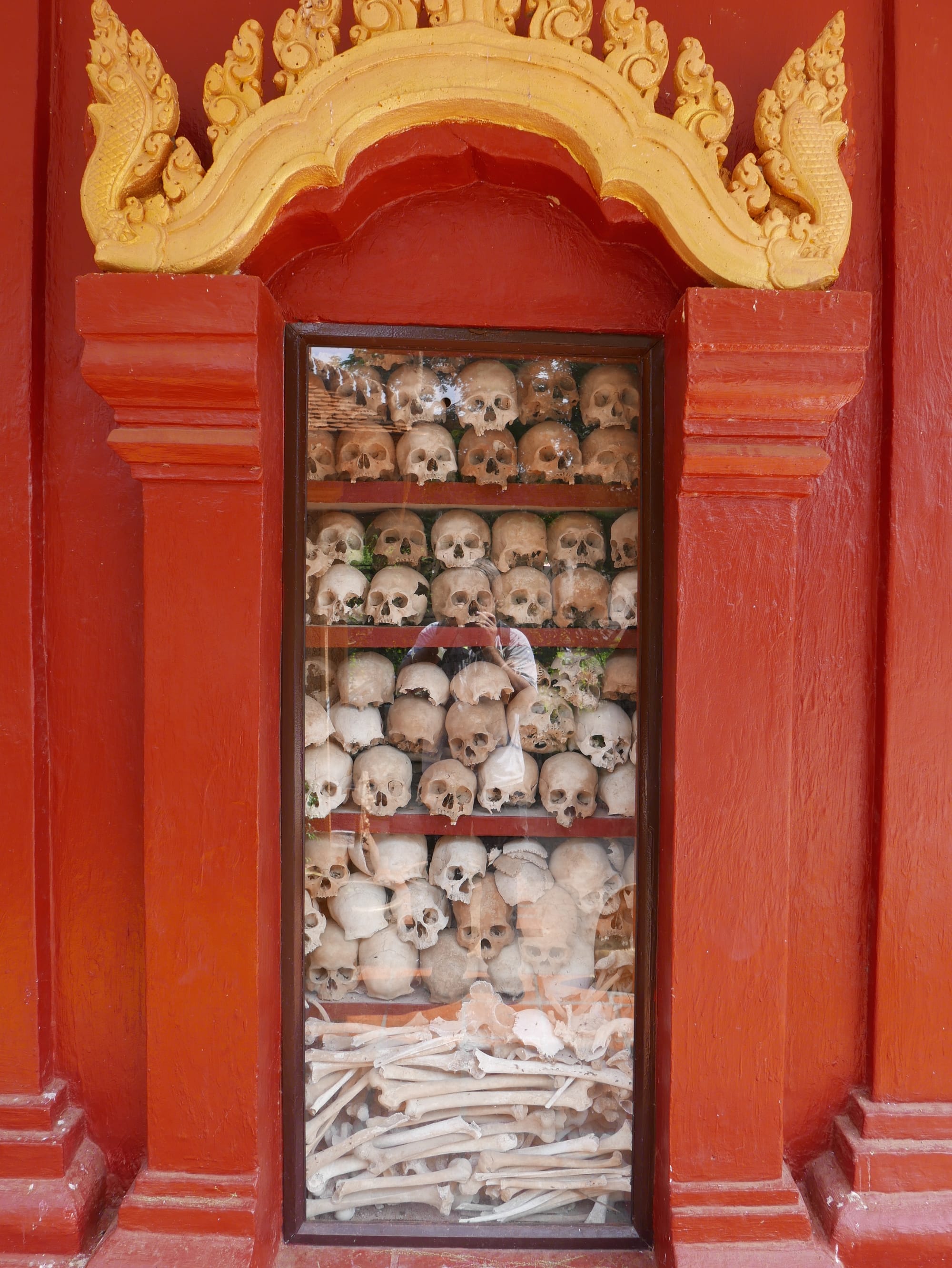 Photo by Author — human skulls at the Wat Thmey Killing Field Memorial, Siem Reap, Cambodia