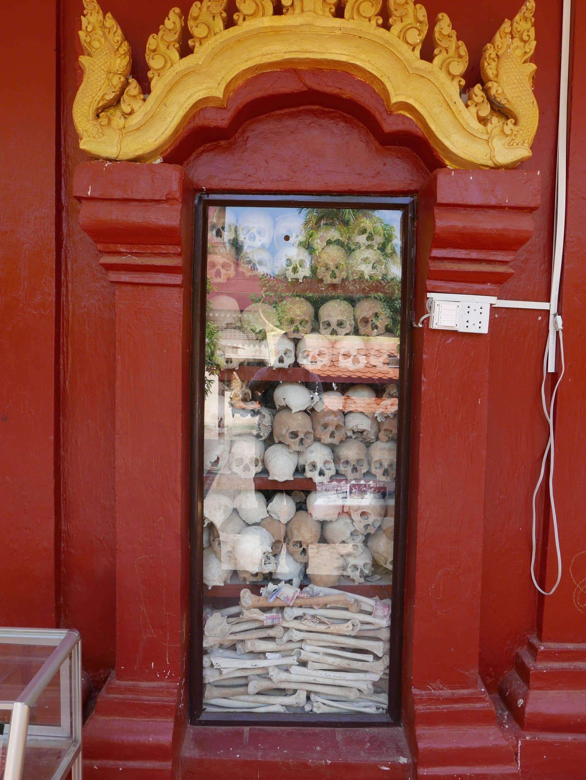 Photo by Author — human skulls at the Wat Thmey Killing Field Memorial, Siem Reap, Cambodia